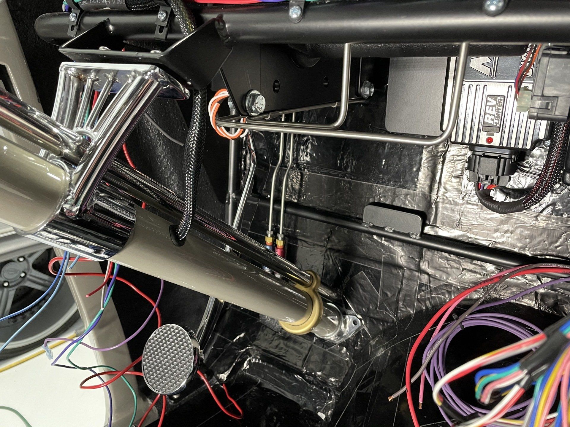 A car with a lot of wires coming out of it