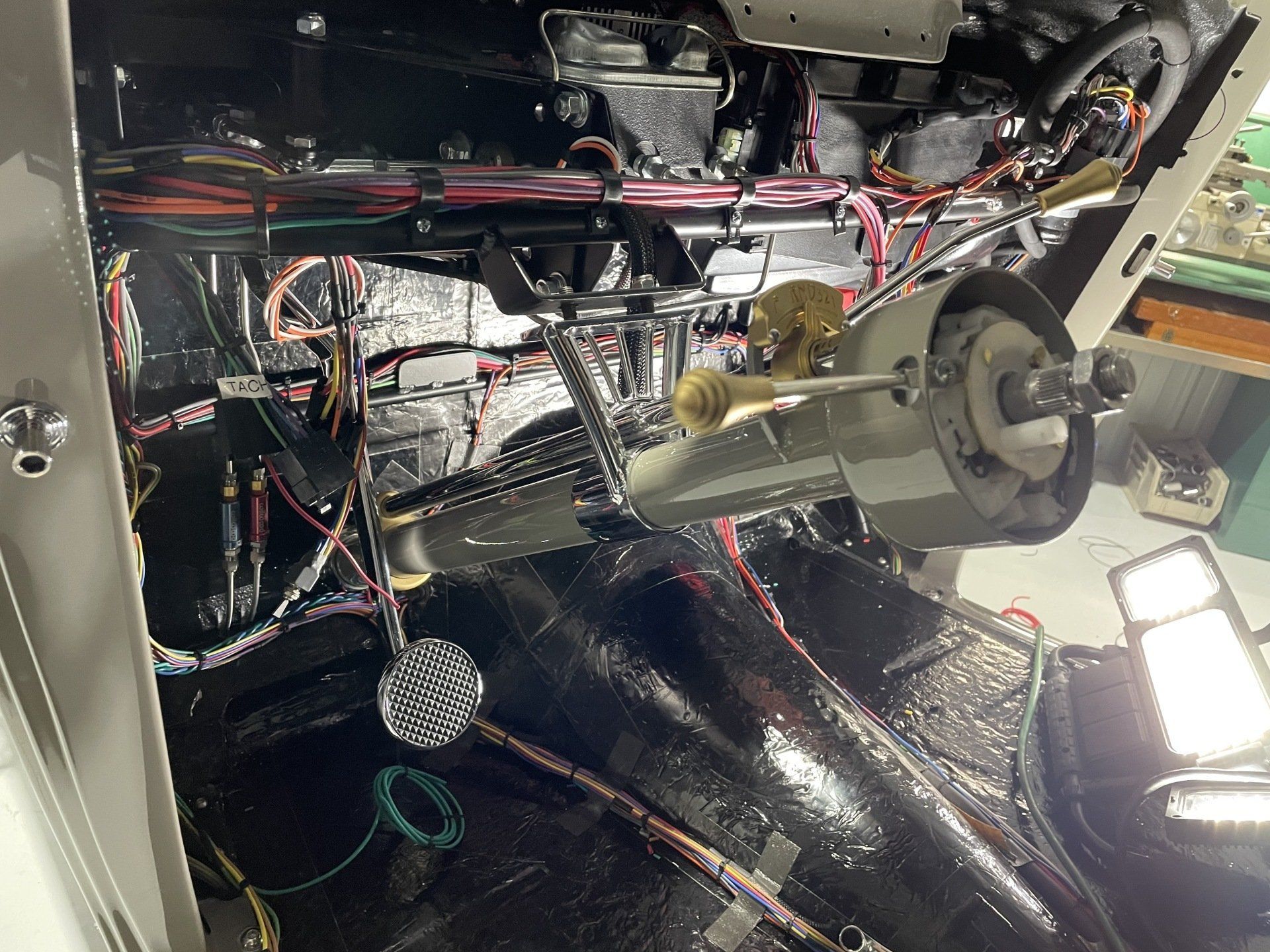 A car engine with a lot of wires coming out of it