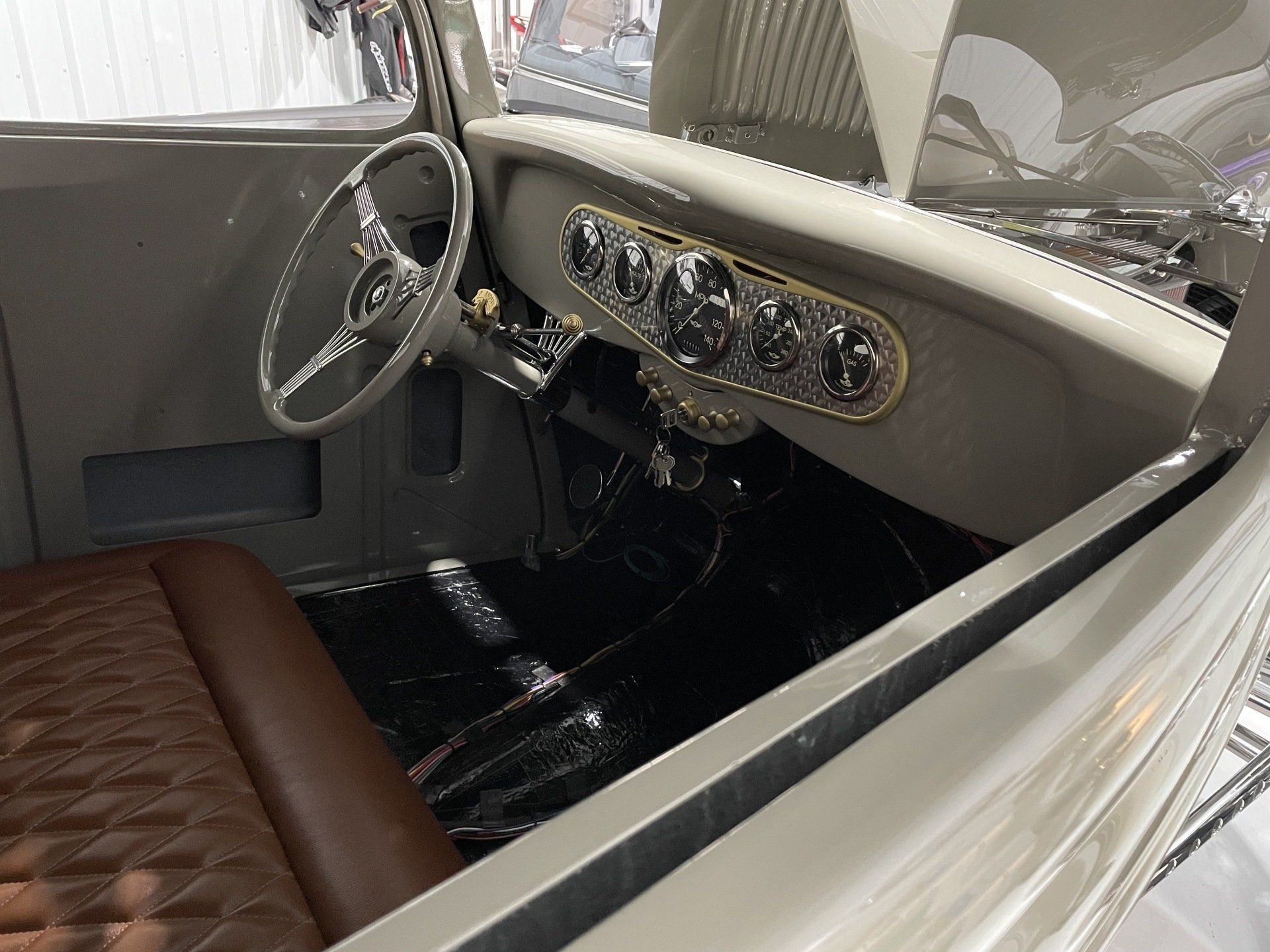 A close up of the interior of a car with a steering wheel