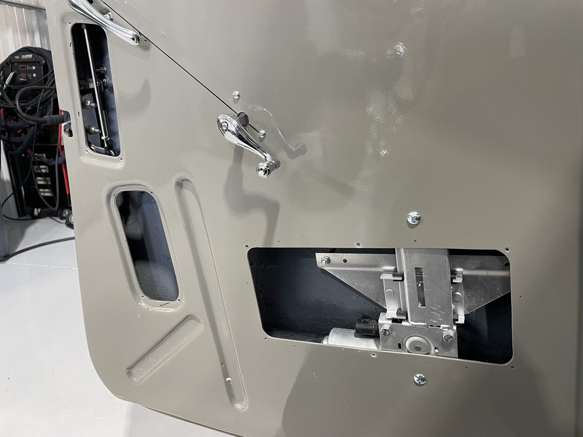 A close up of a car door with a lock on it.