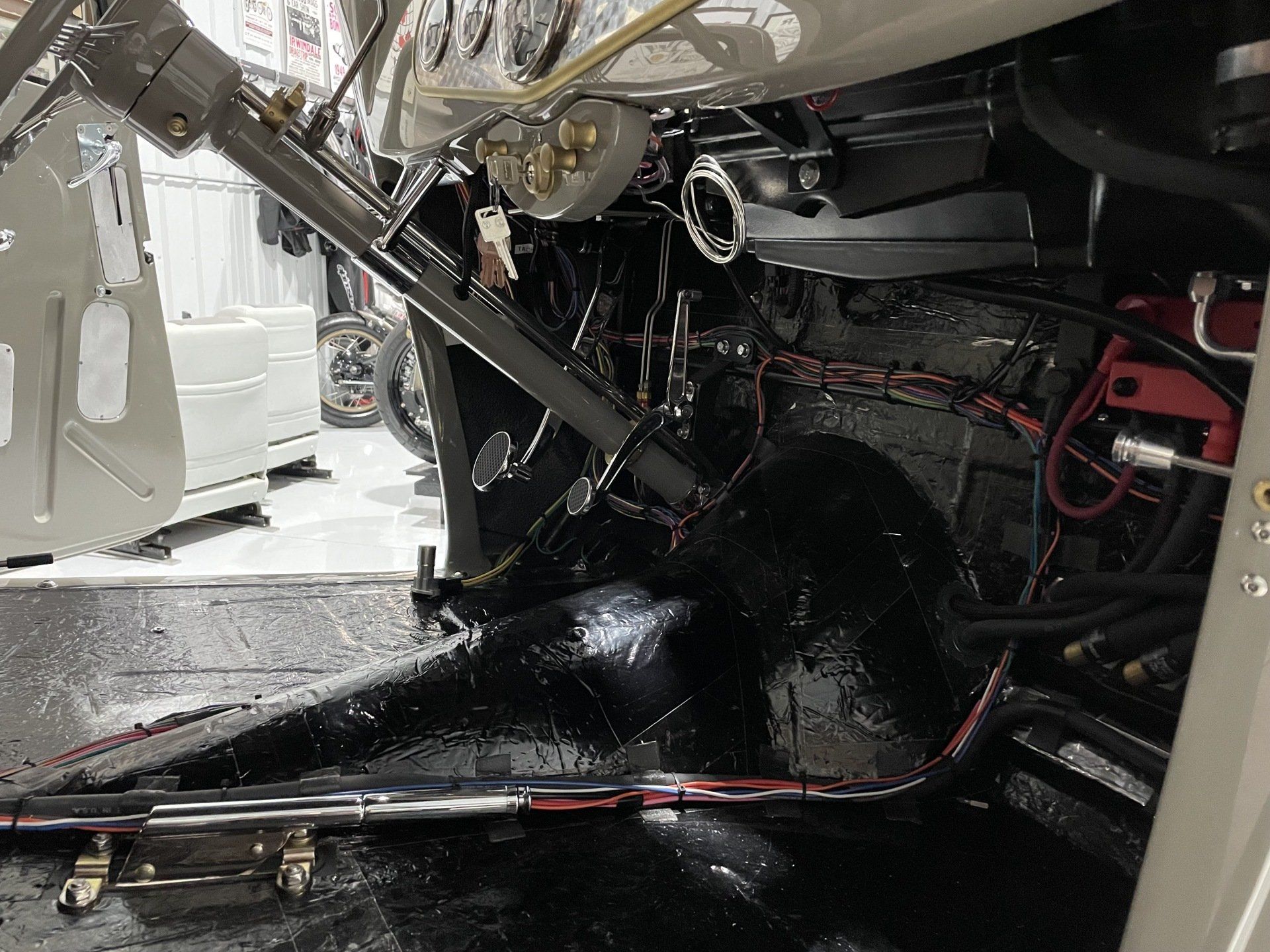 The inside of a car with a lot of wires coming out of it