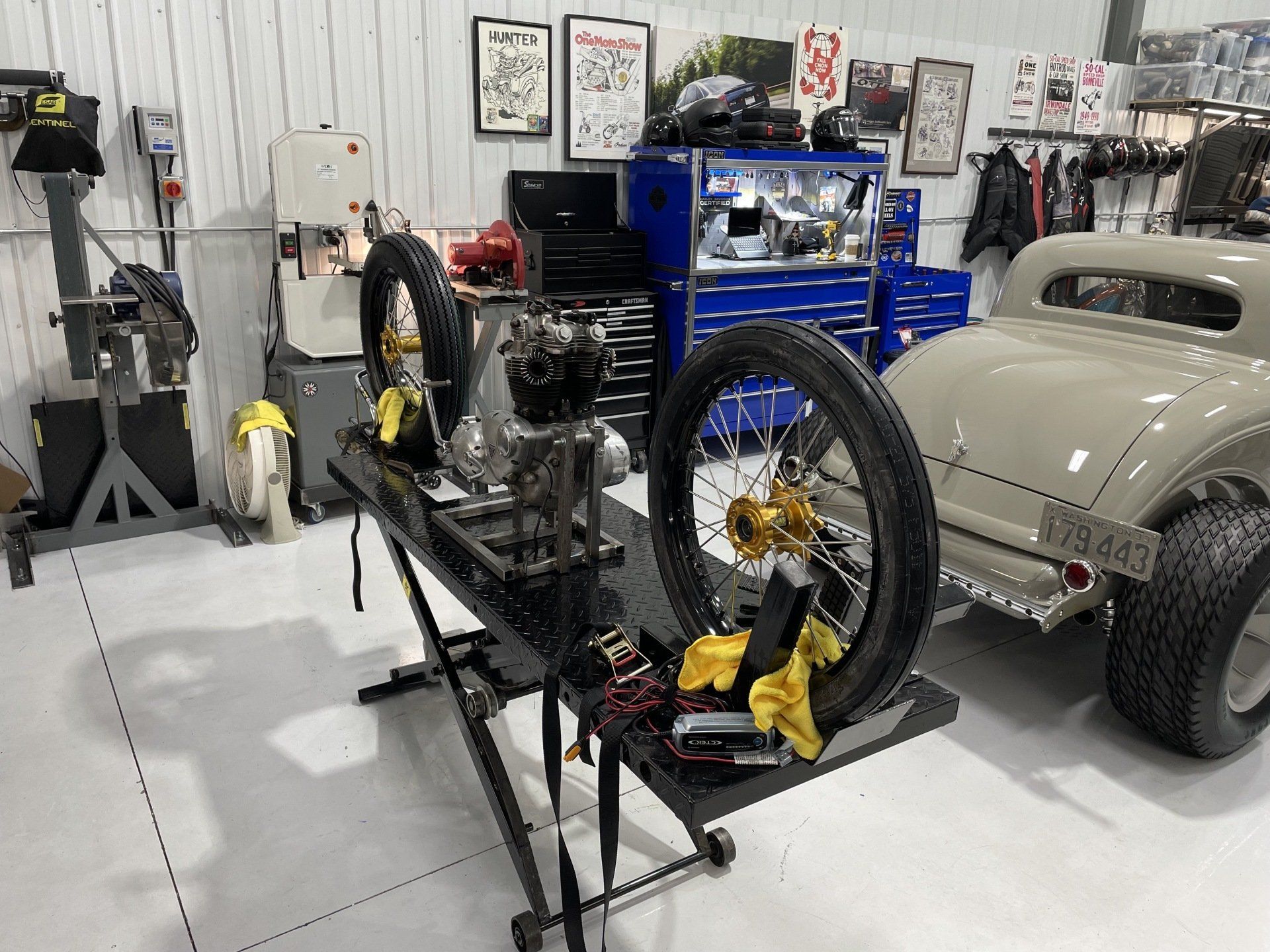 A car is being worked on in a garage.