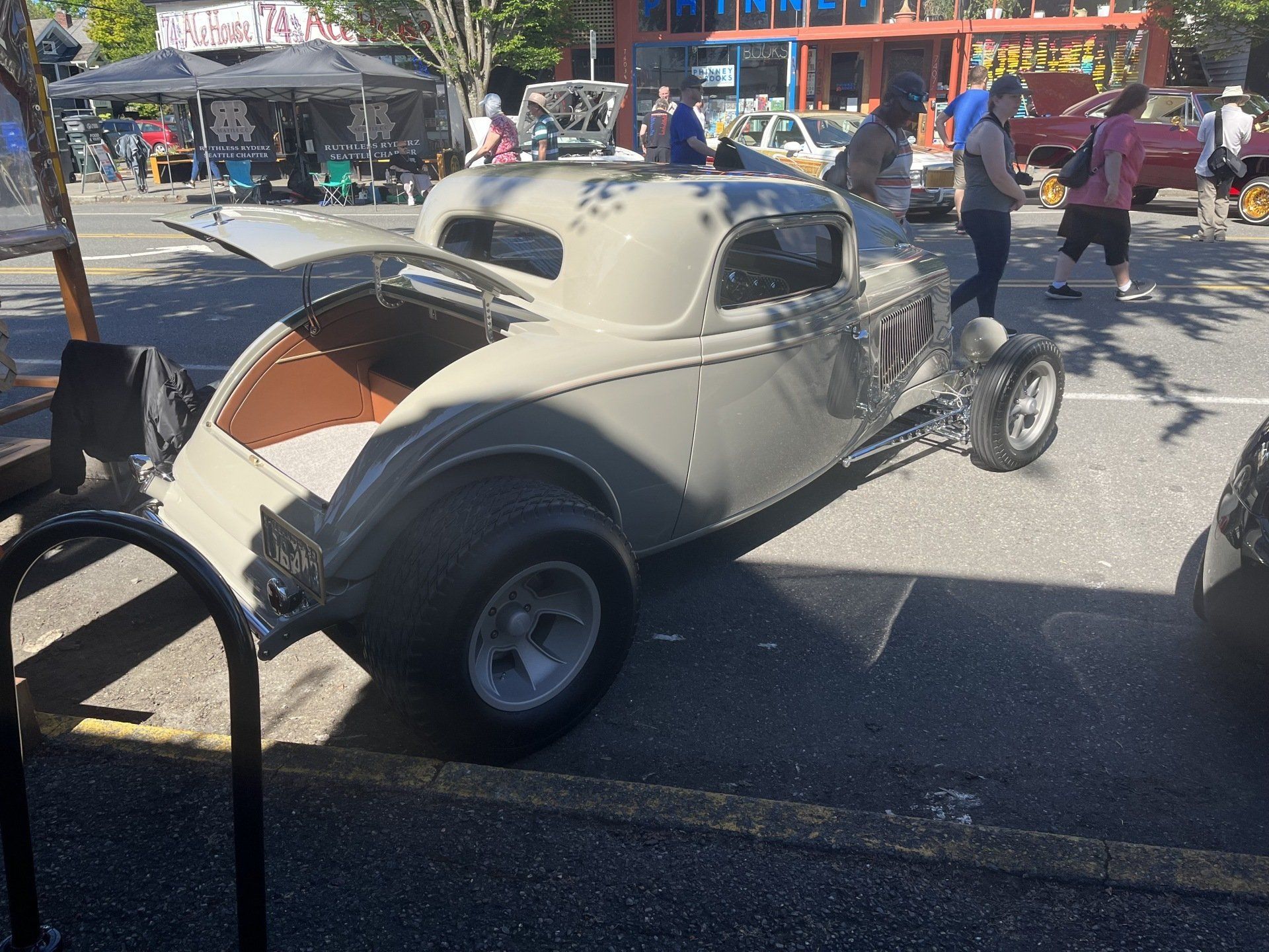 A car with the number 219 on it is parked on the side of the road