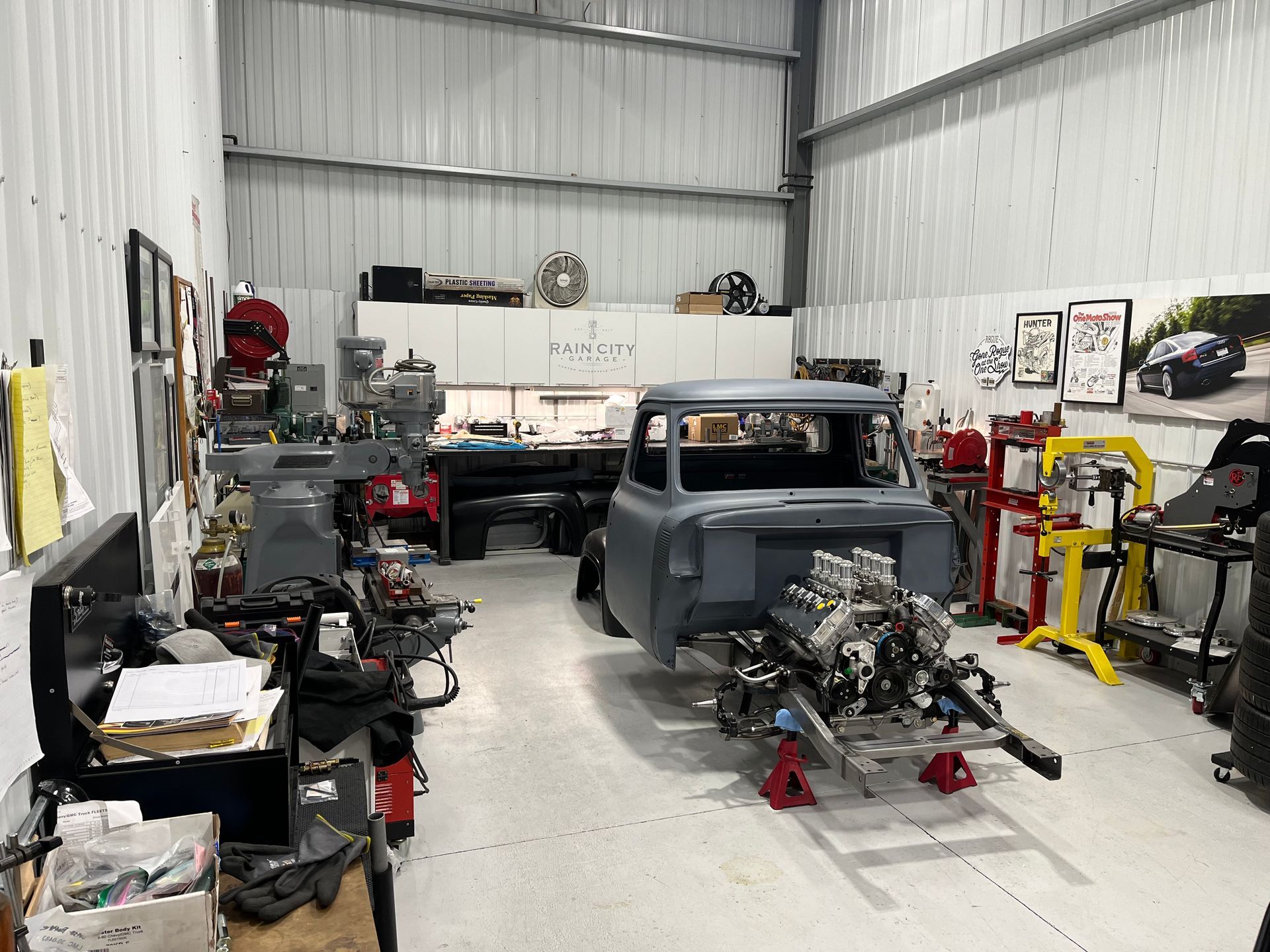 A car is being worked on in a garage.