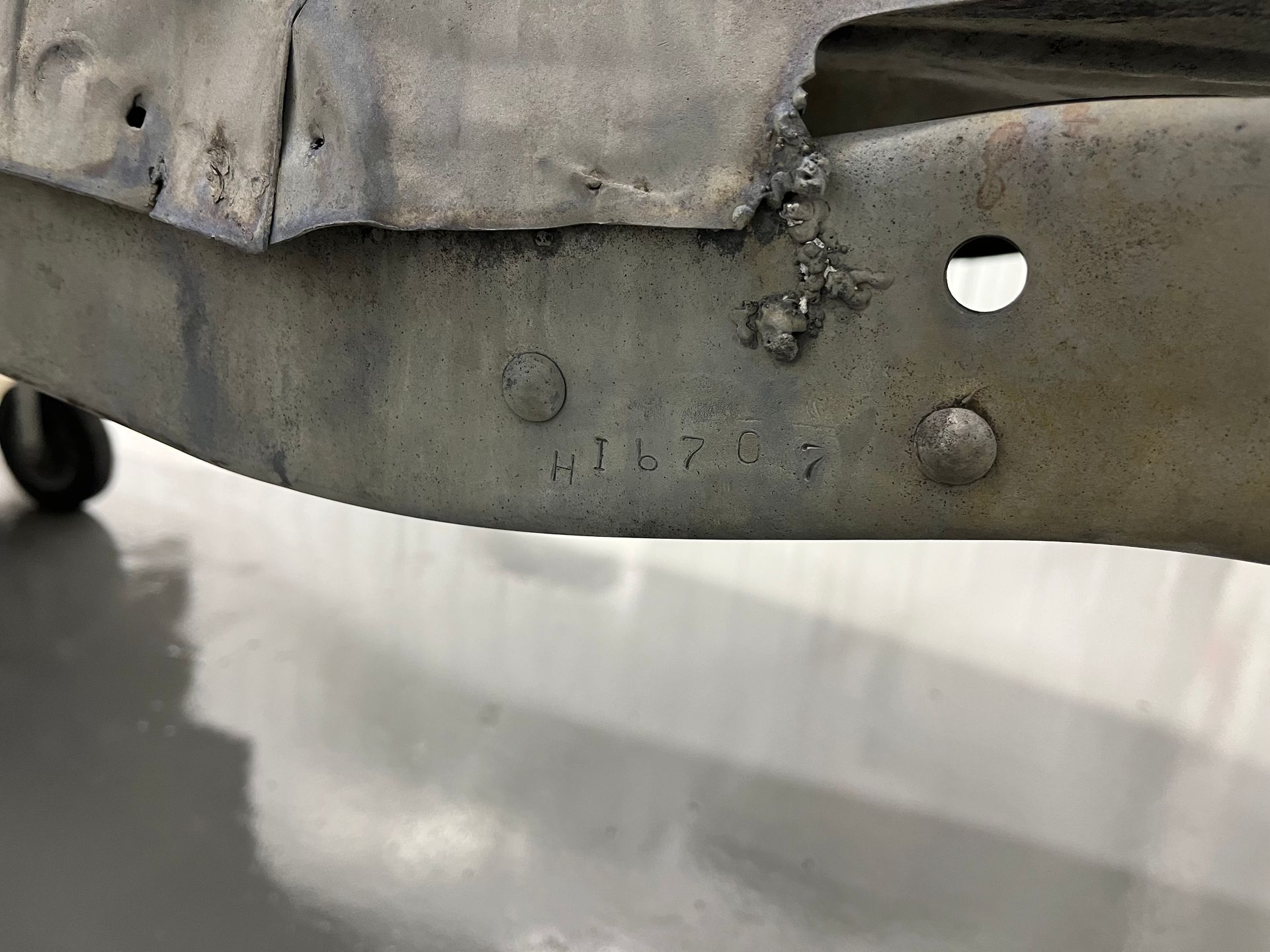 A close up of a metal frame with a hole in it.