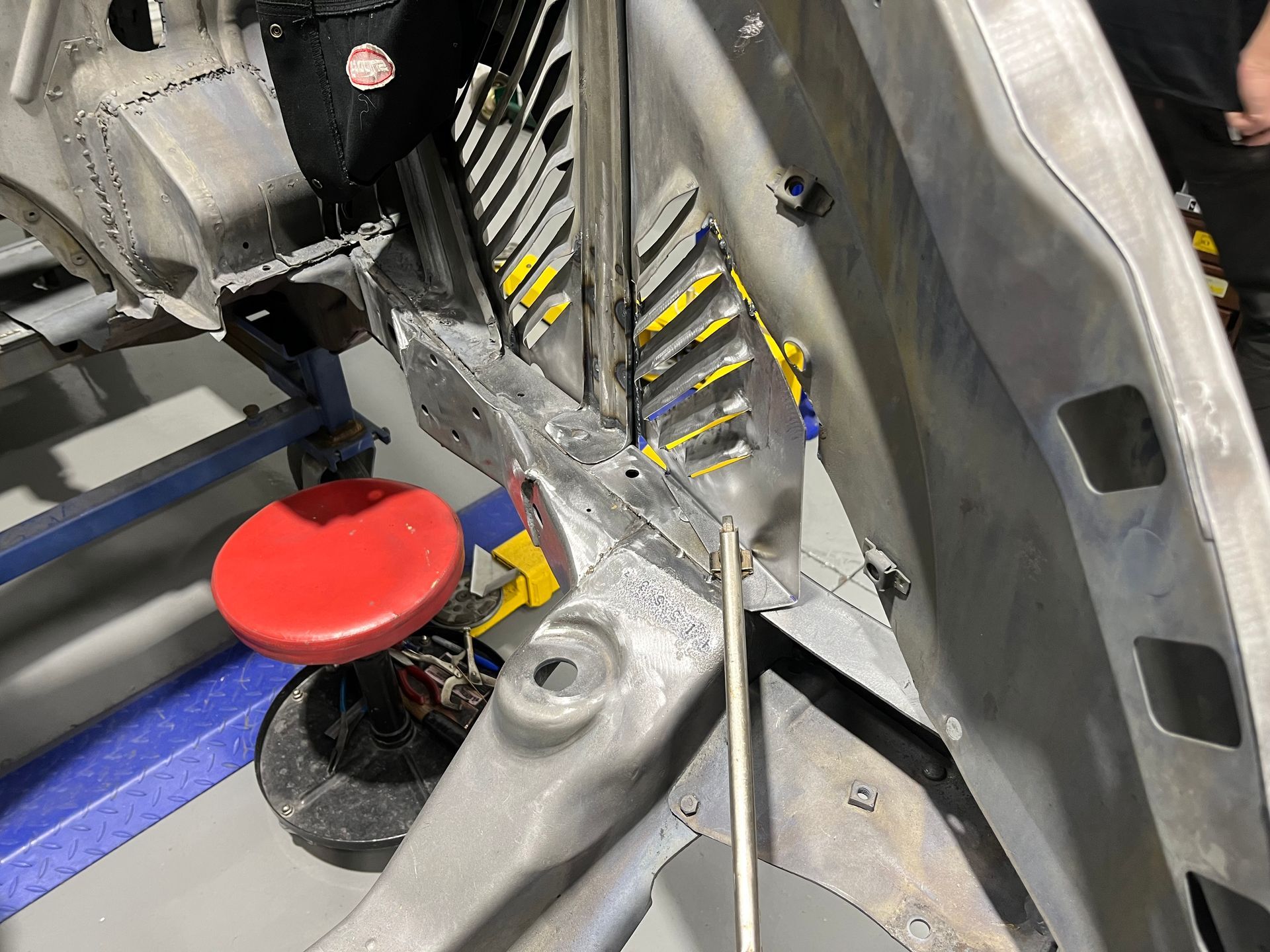 A close up of a red button on the side of a car.