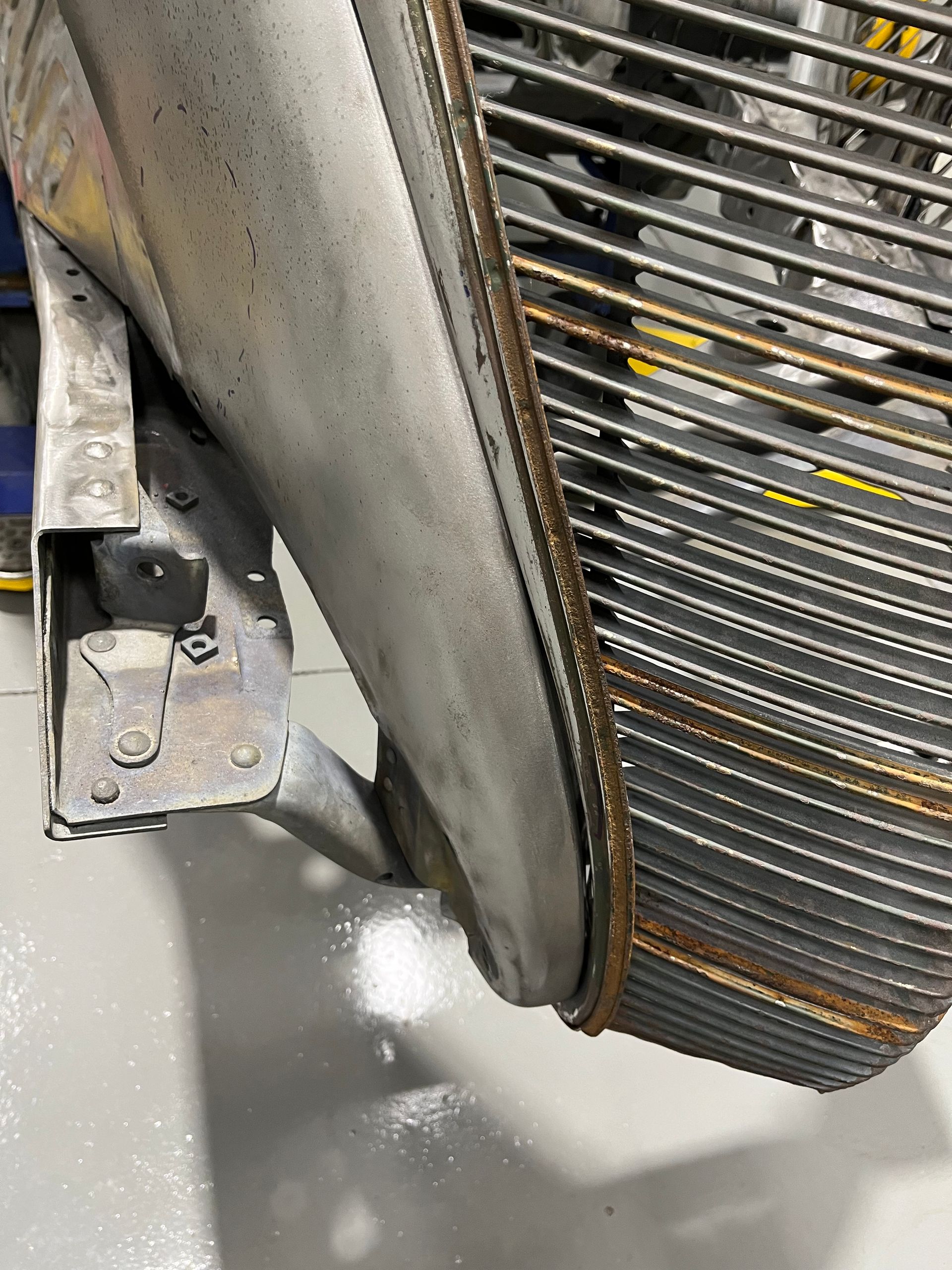 A close up of a metal grille on a car.