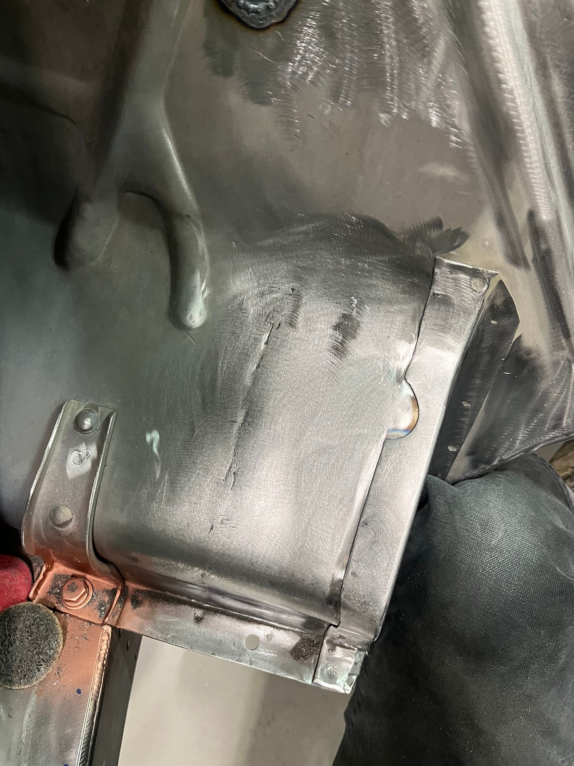 A close up of a piece of metal with a hole in it.