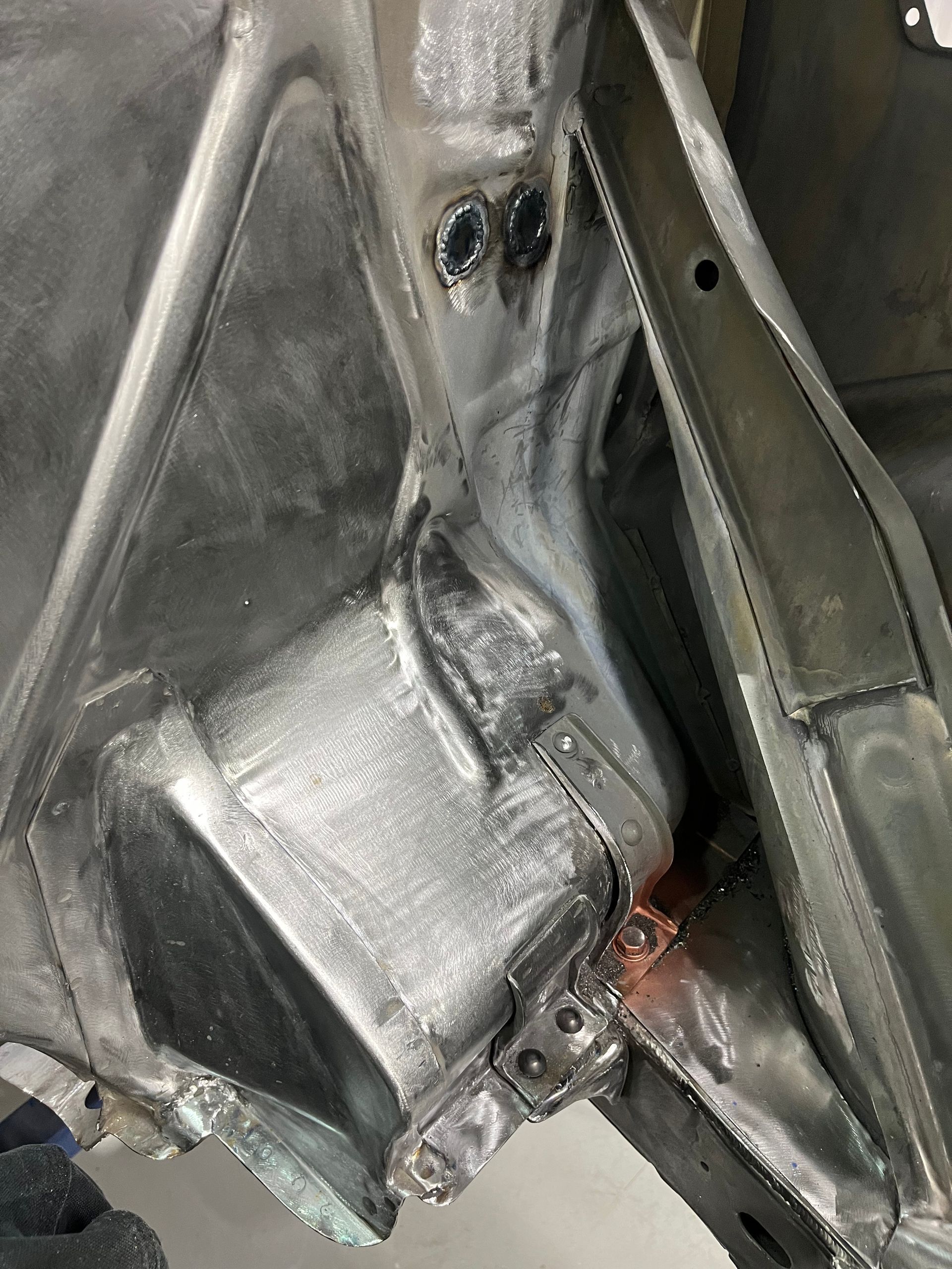 A close up of a piece of metal on a car.