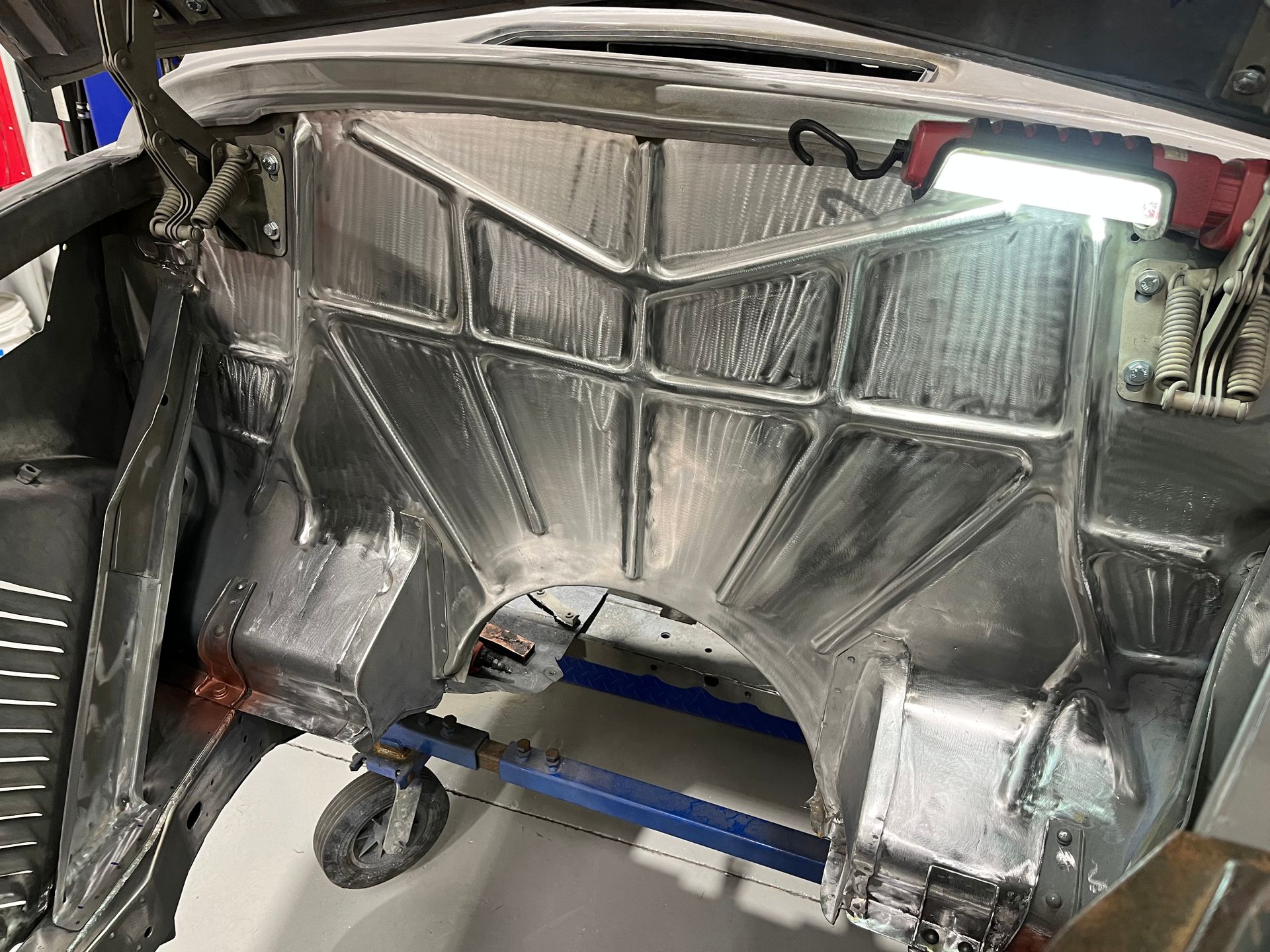 A car is sitting on a cart with a light on it.