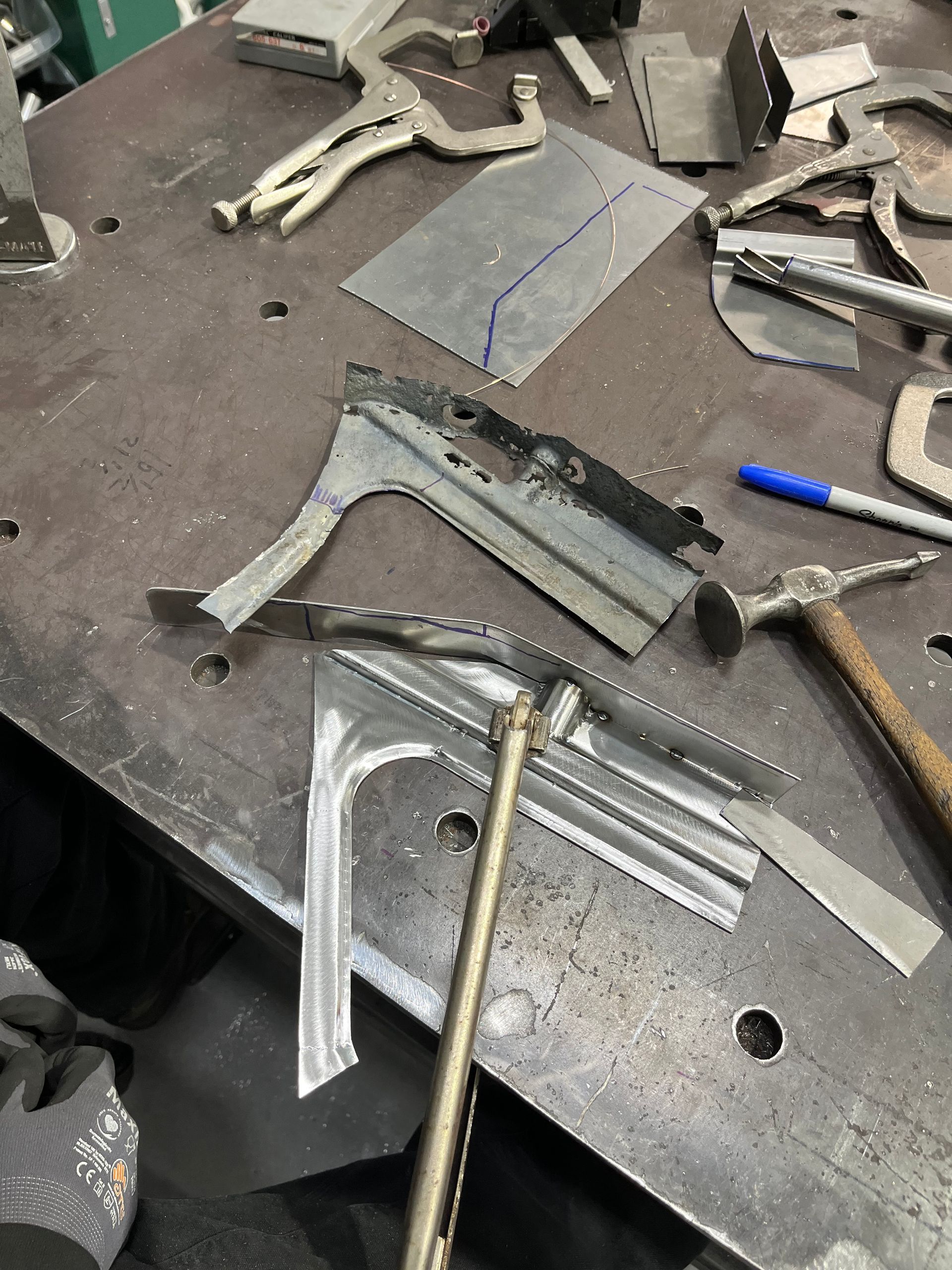A welding table with a lot of tools on it