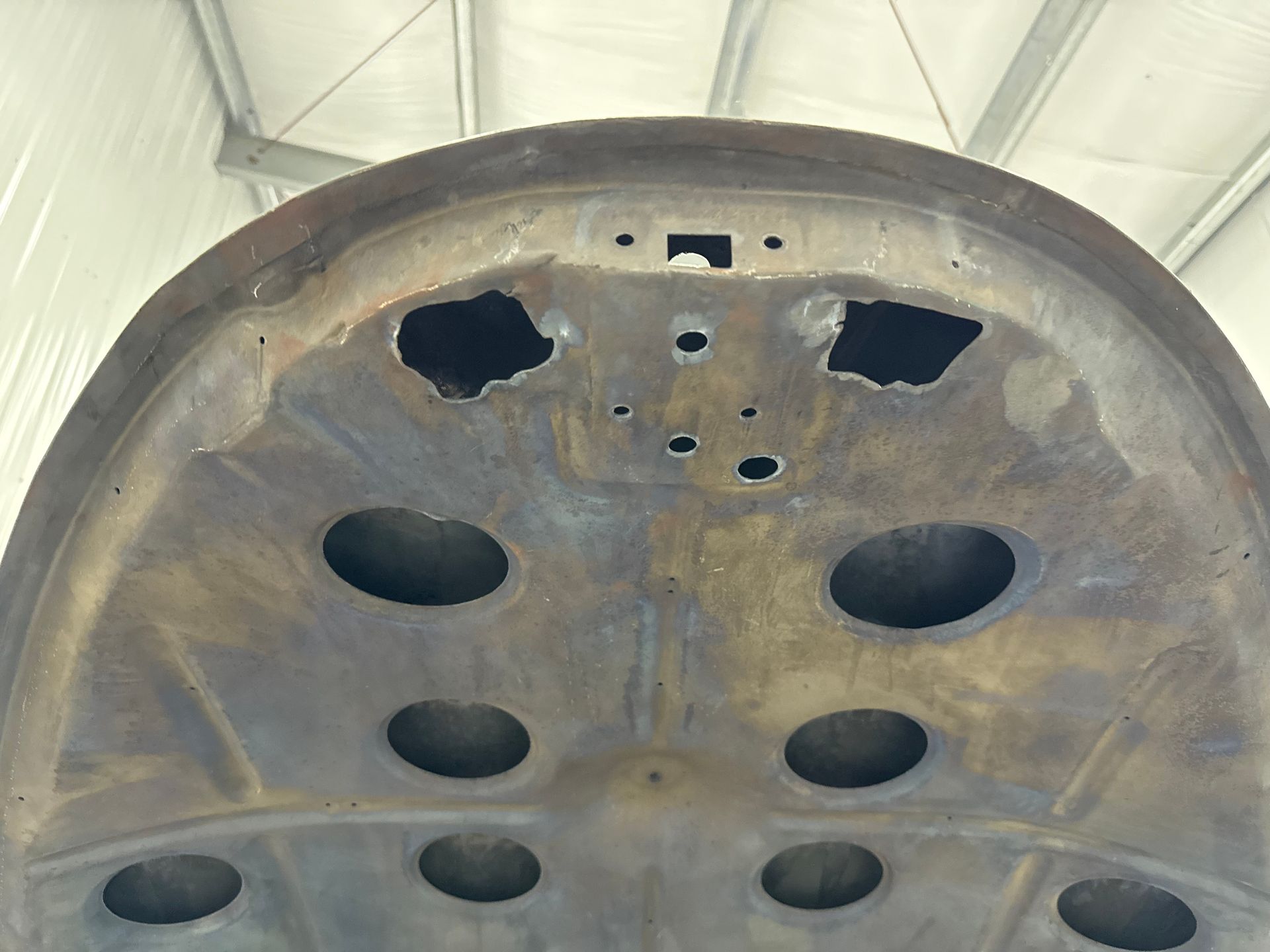 A close up of a metal object with holes in it