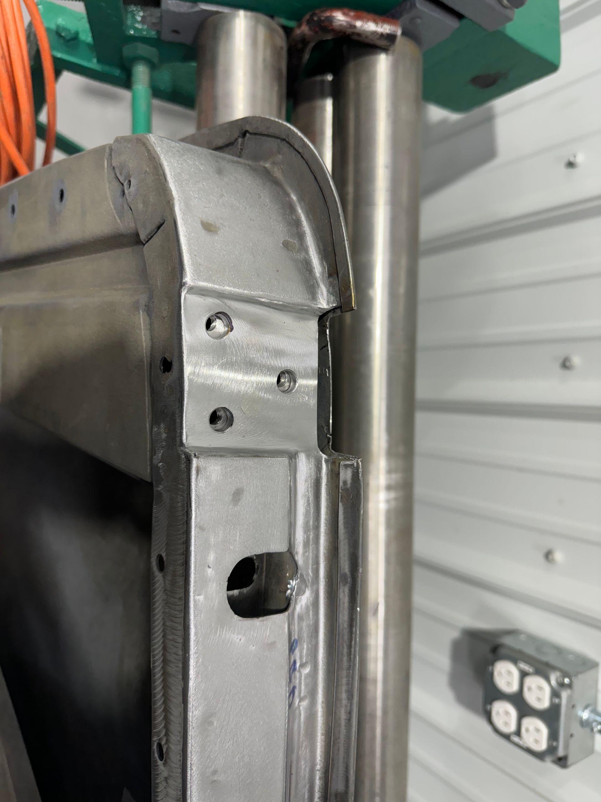 A close up of a piece of metal with a hole in it