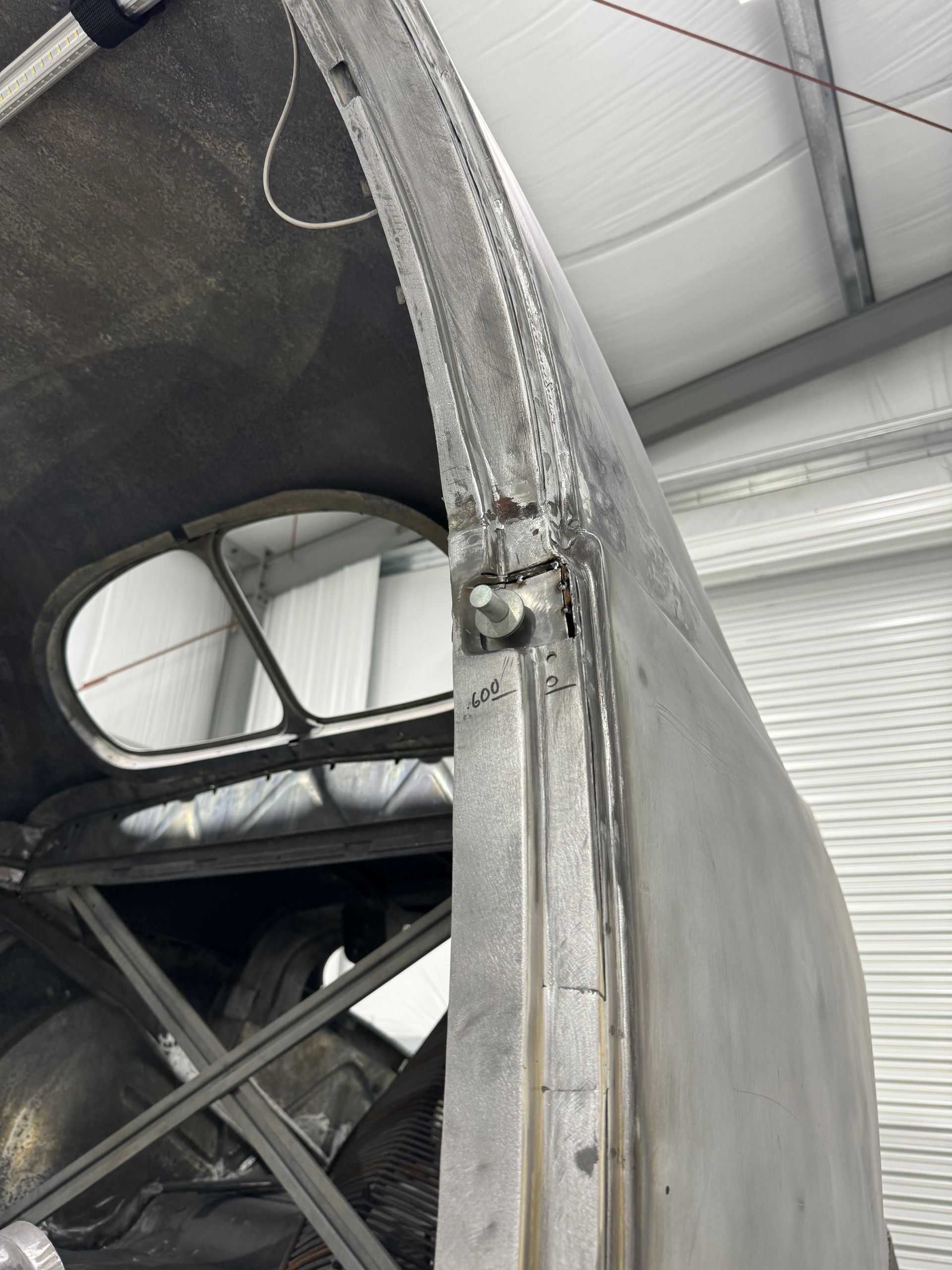 A close up of a metal object in a garage.