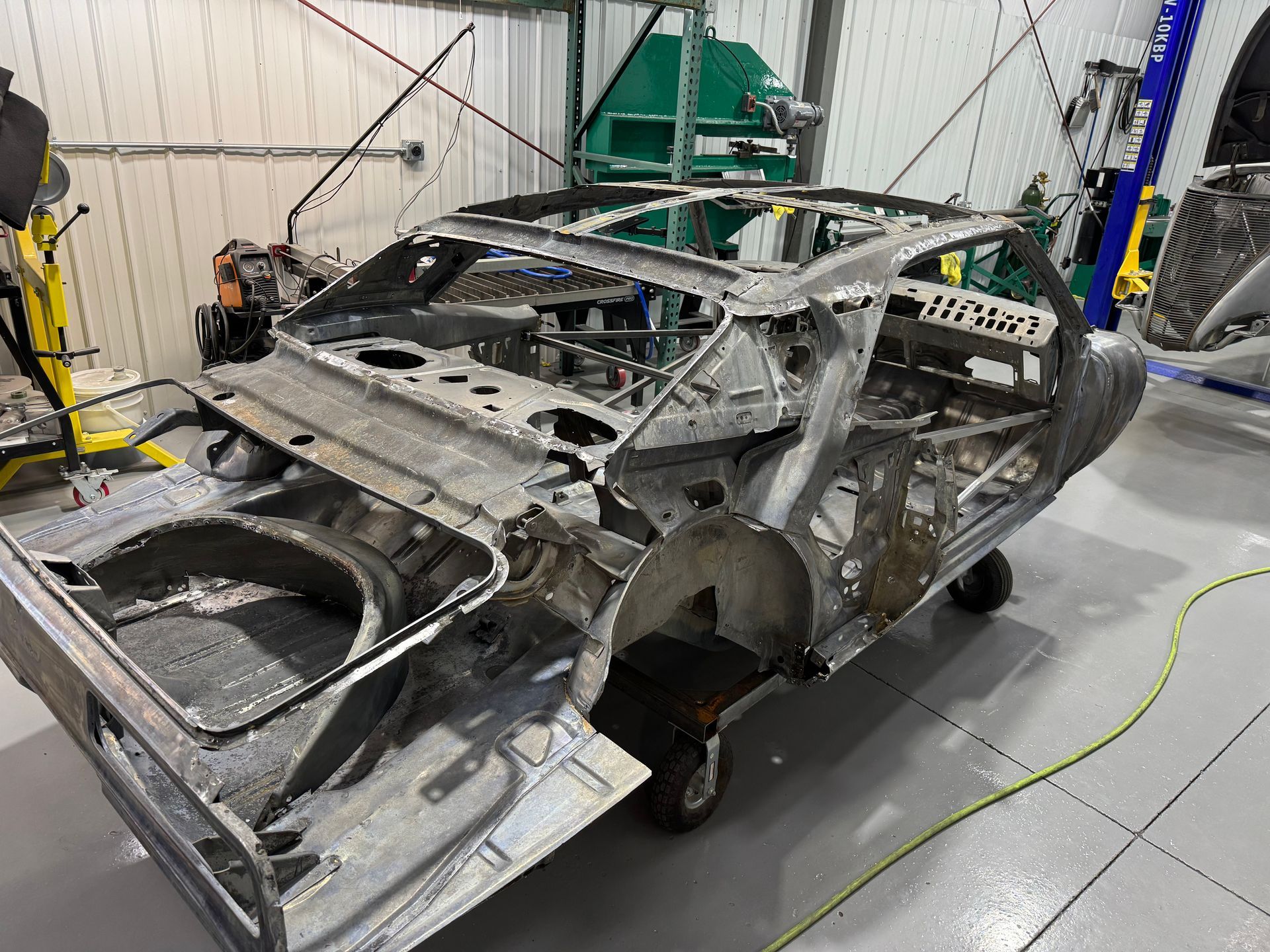 A car is being built in a garage.