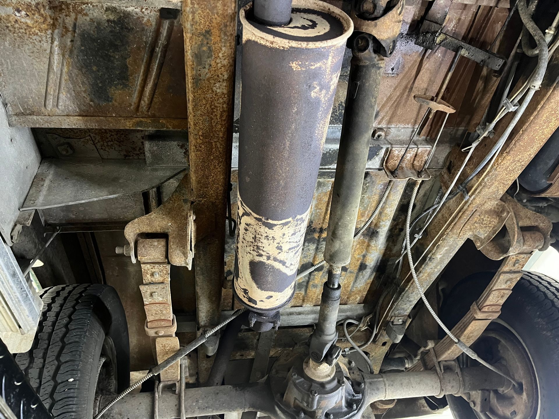 A close up of the underside of a truck.