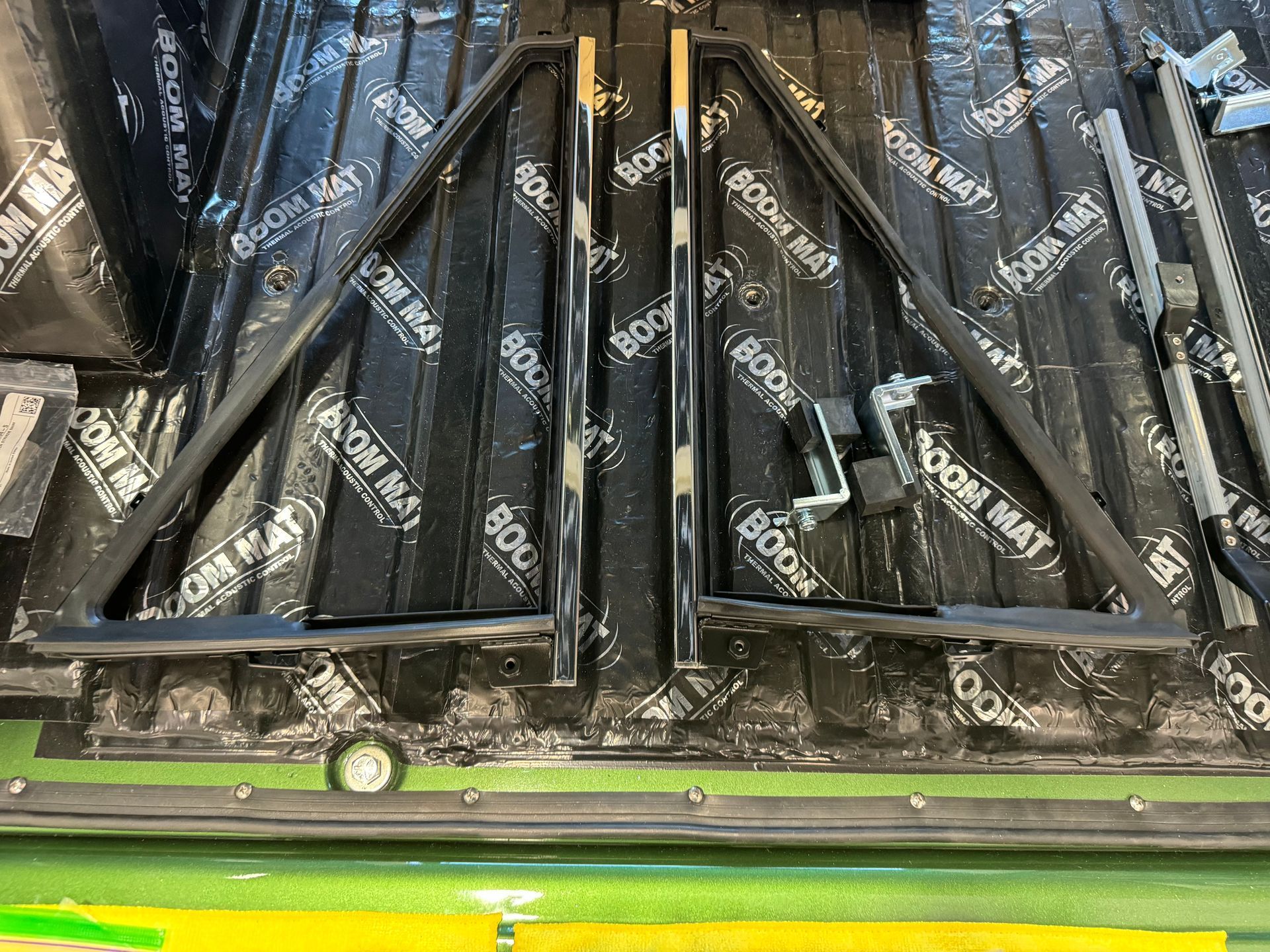 A metal frame is sitting on top of a wooden floor.