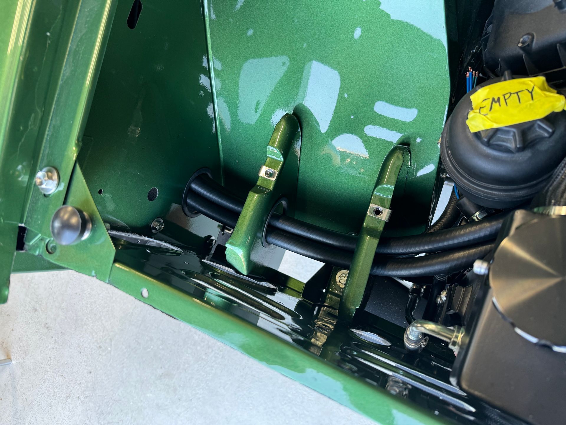 A close up of a green car with a yellow tag that says empty