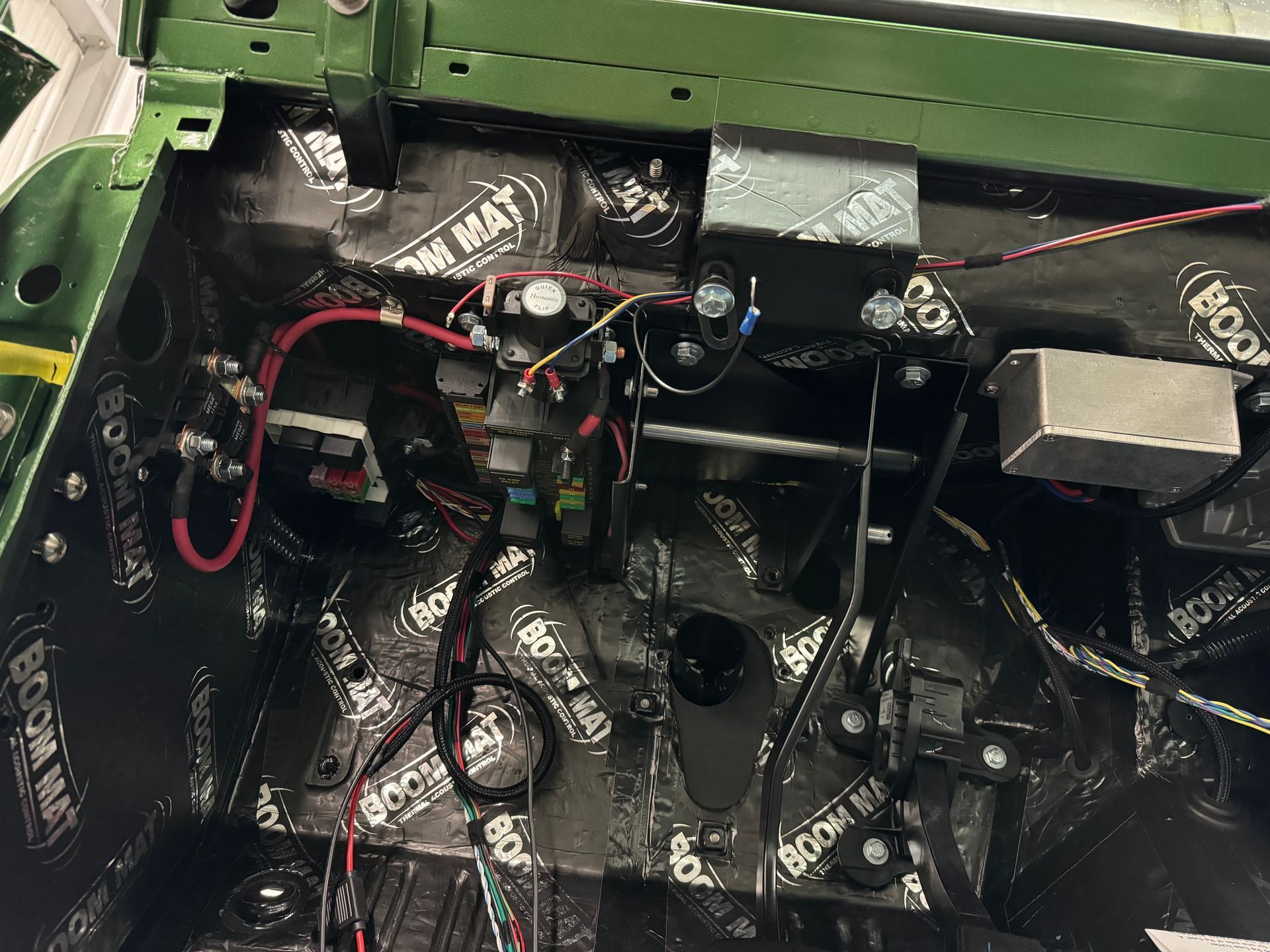 The inside of a car with a lot of wires coming out of it.