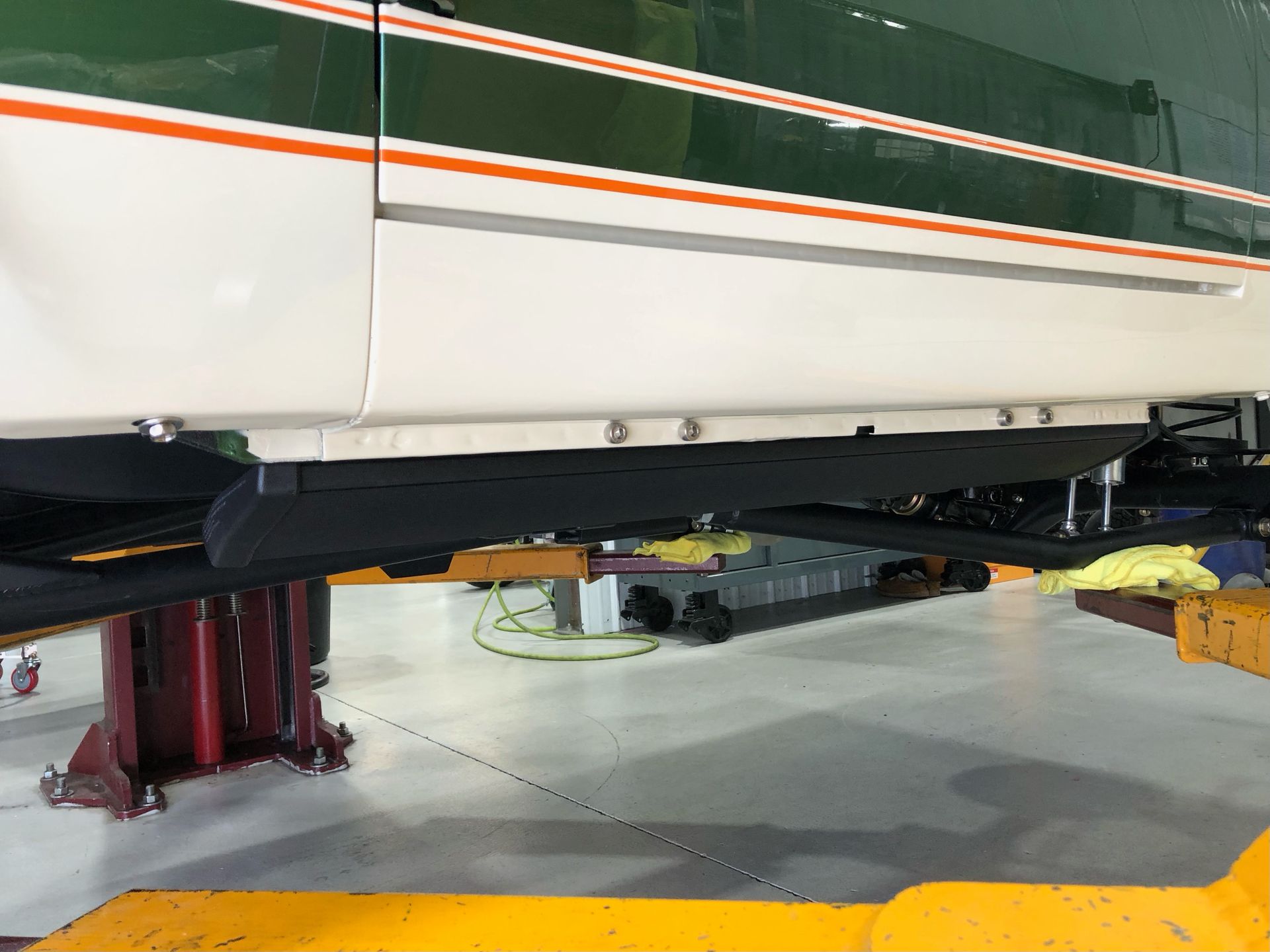 A car is sitting on a lift in a garage