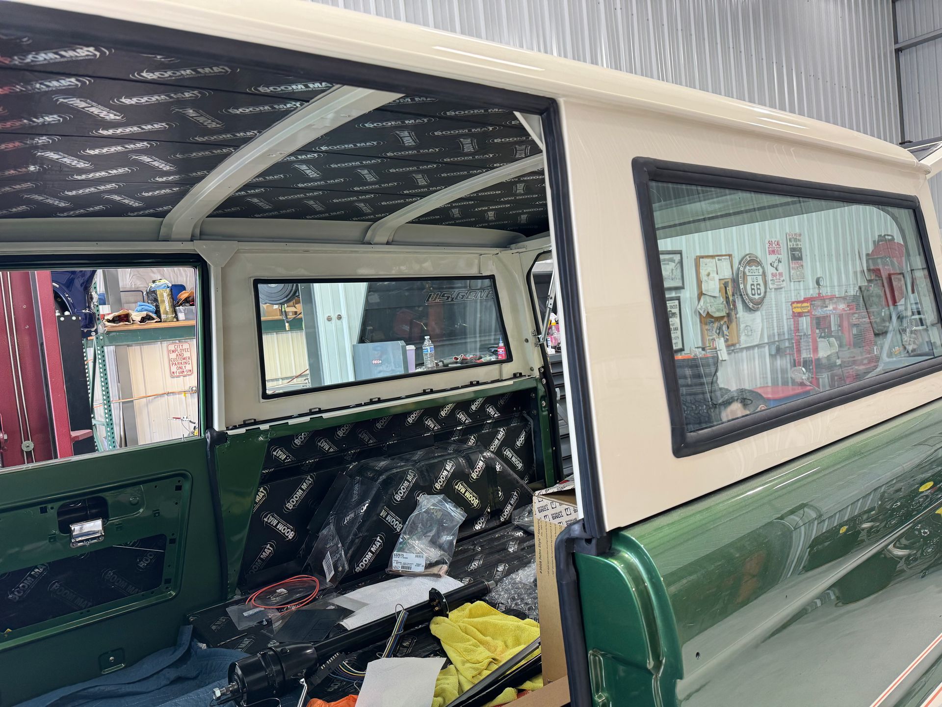 The inside of a green truck with a canopy on top of it.
