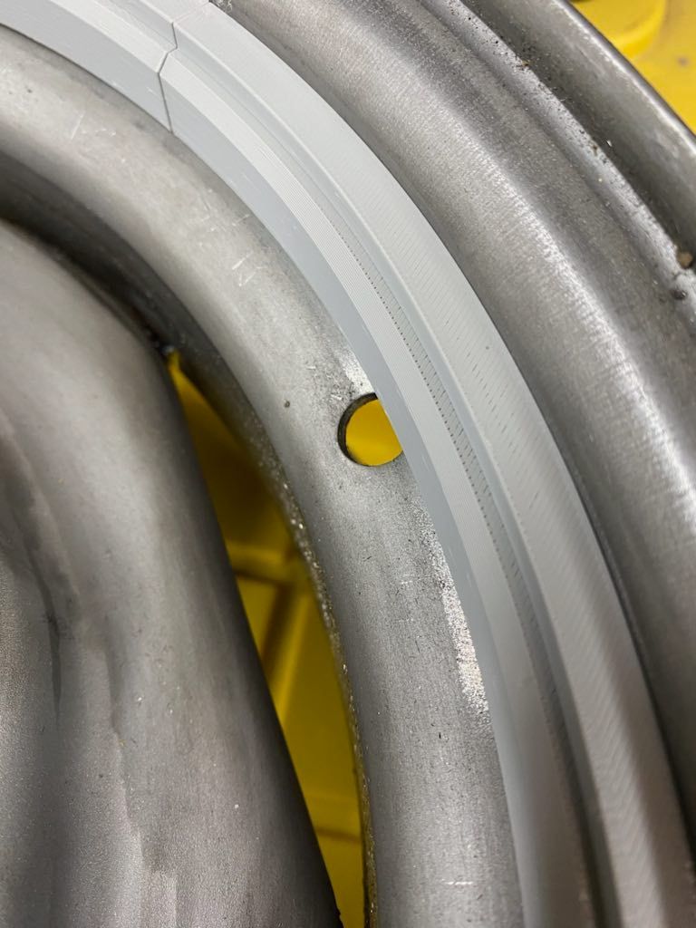 A close up of a wheel with a hole in it.