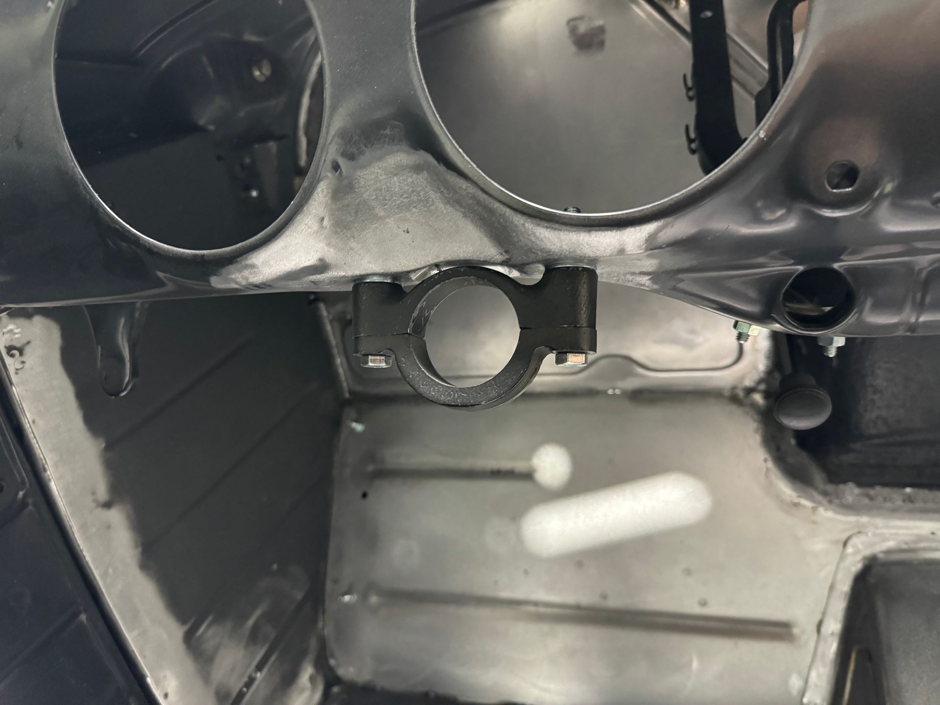 A close up of a steering wheel in a car.