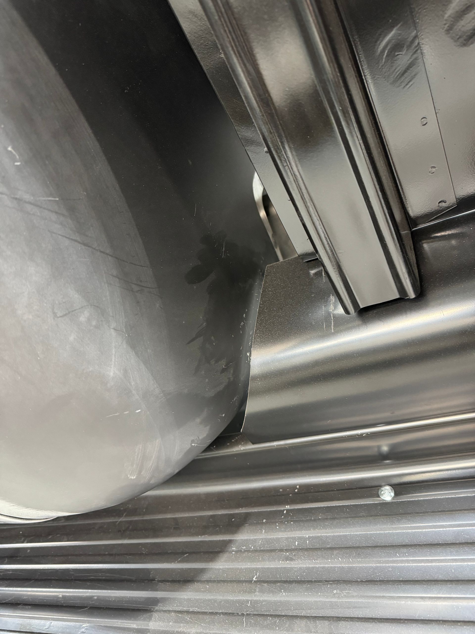 A close up of a metal object with a hole in it.