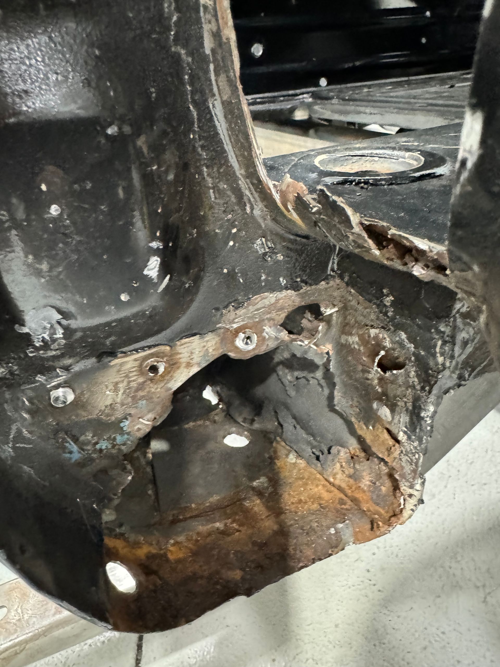 A close up of a piece of metal with rust on it.