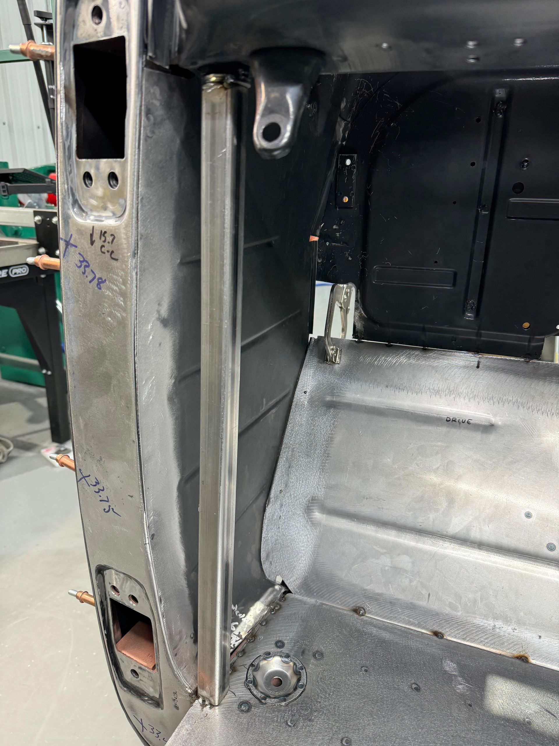 A close up of a metal object in a garage.