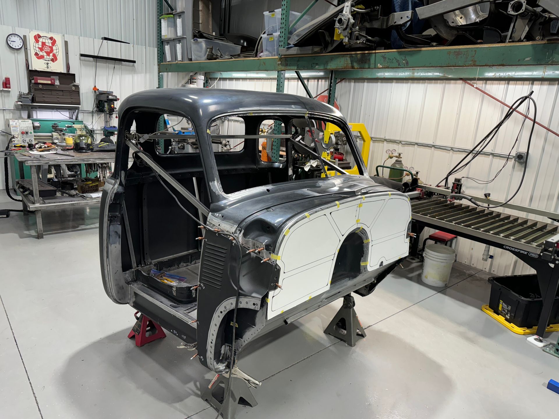 A car is being built in a garage.