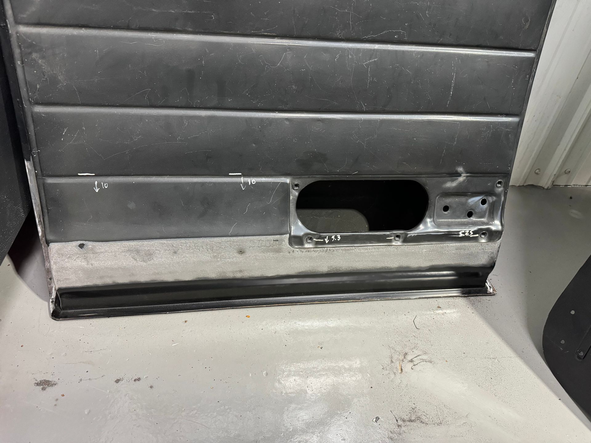 A close up of a door with a hole in it.