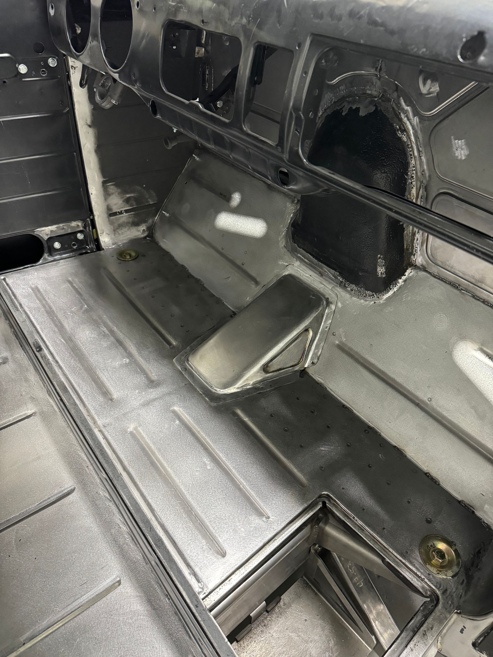A close up of the inside of a car that is being built.