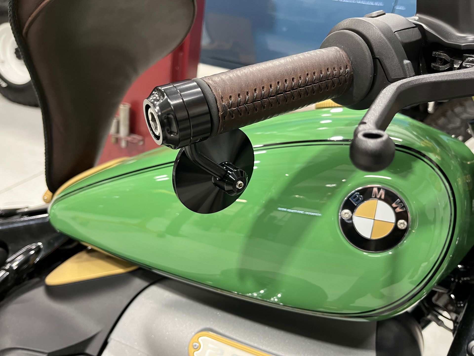 A green motorcycle with a bmw logo on the tank