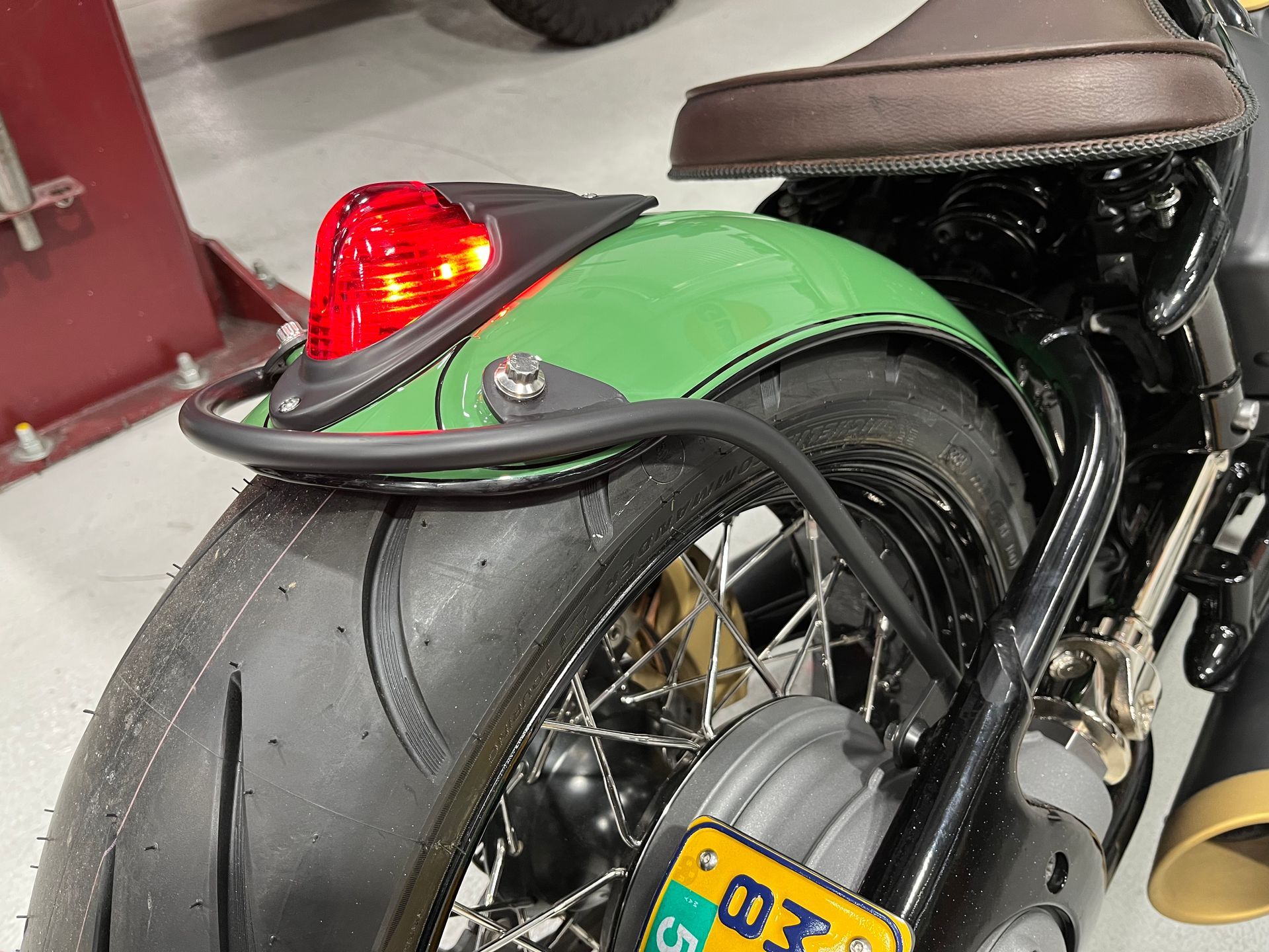 A motorcycle with a license plate that says 03 on it