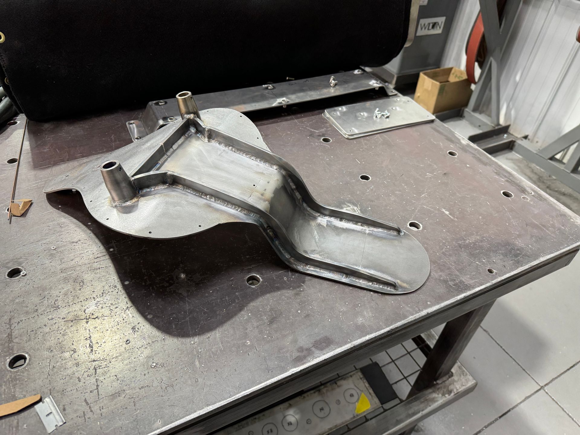 A piece of metal is sitting on top of a table