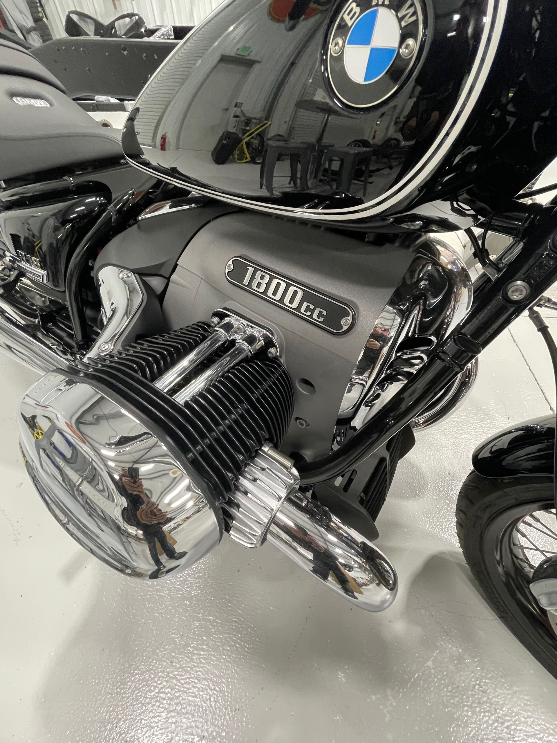 A bmw motorcycle is parked in a garage.