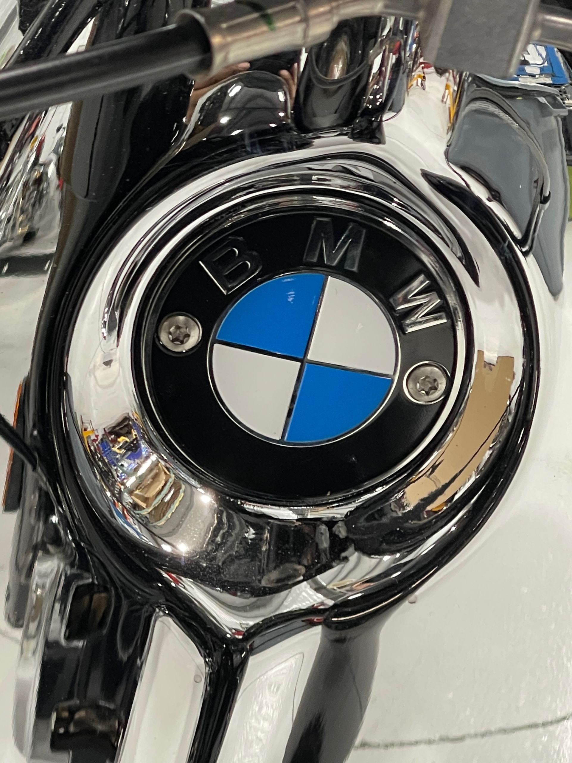 A close up of a bmw logo on a motorcycle