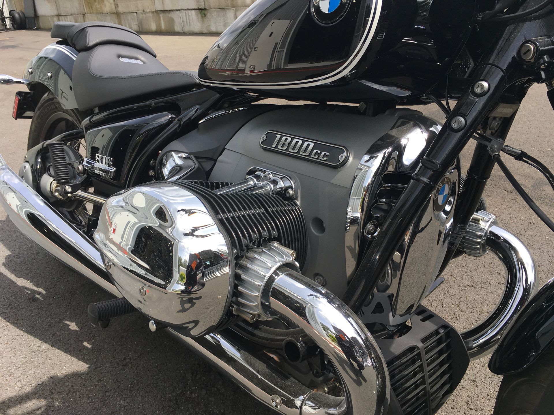 A bmw motorcycle is parked on the side of the road.