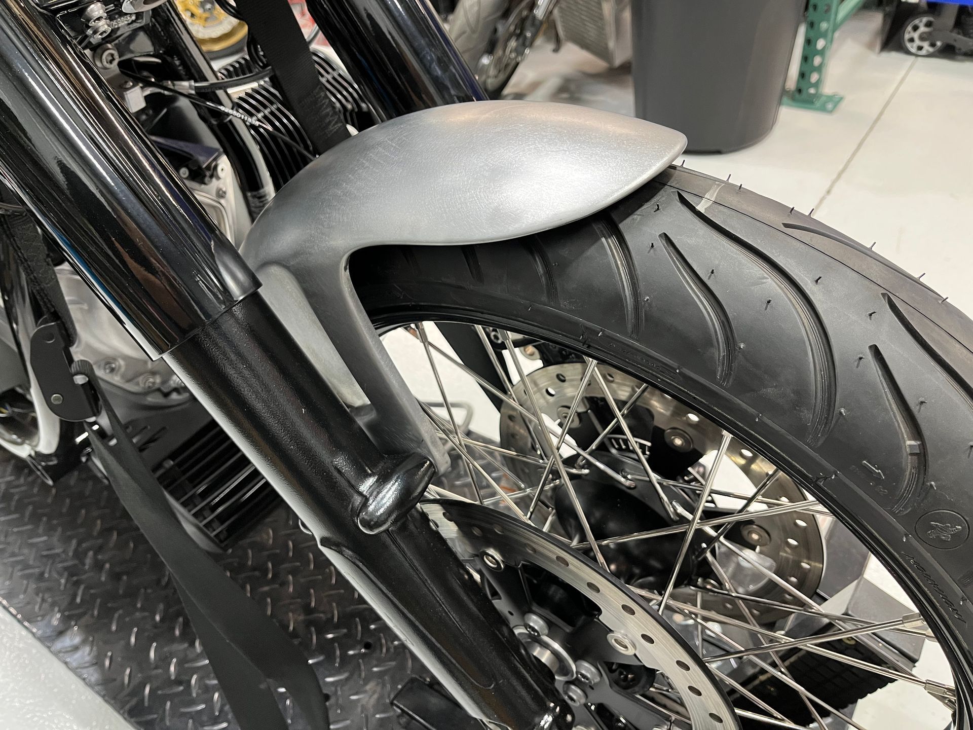 A close up of the front wheel of a motorcycle