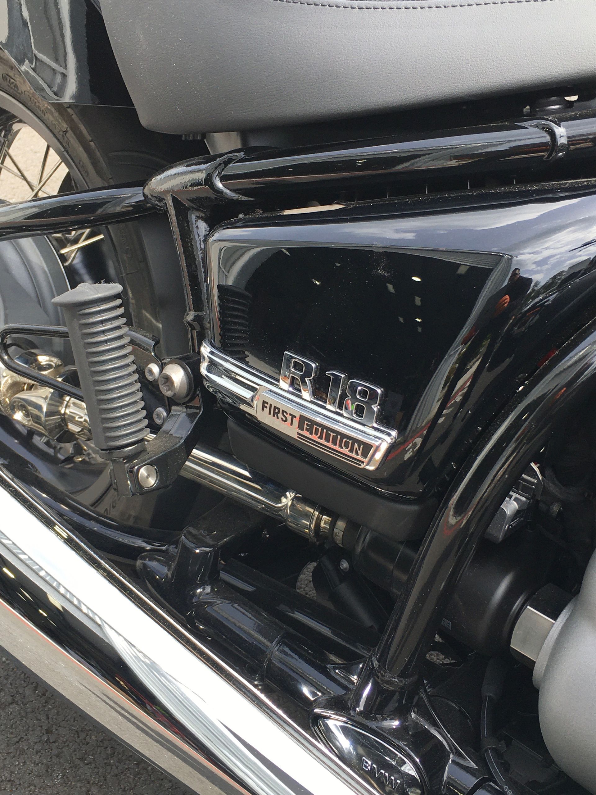 A close up of the side of a black motorcycle