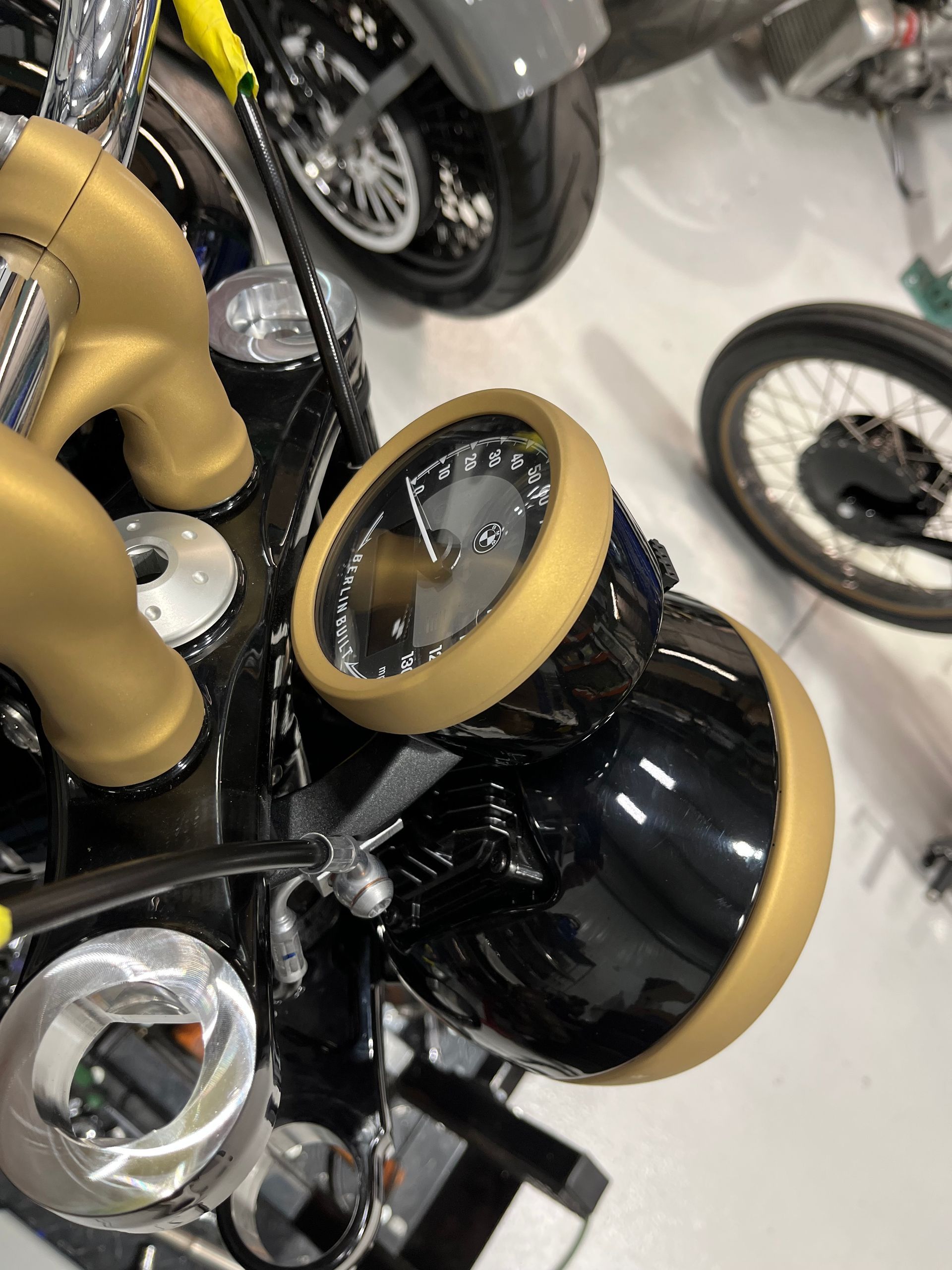 A close up of a motorcycle with a clock on it