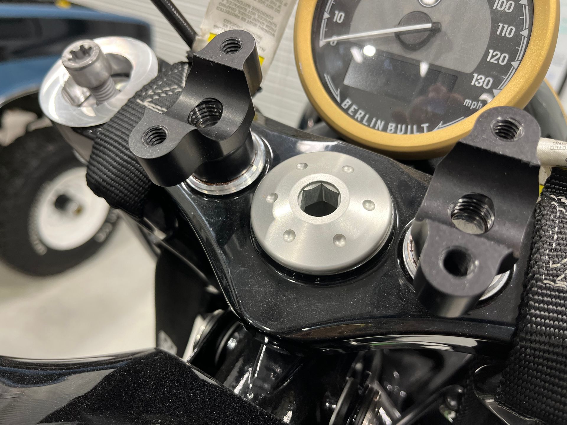 A close up of a motorcycle with a speedometer on it