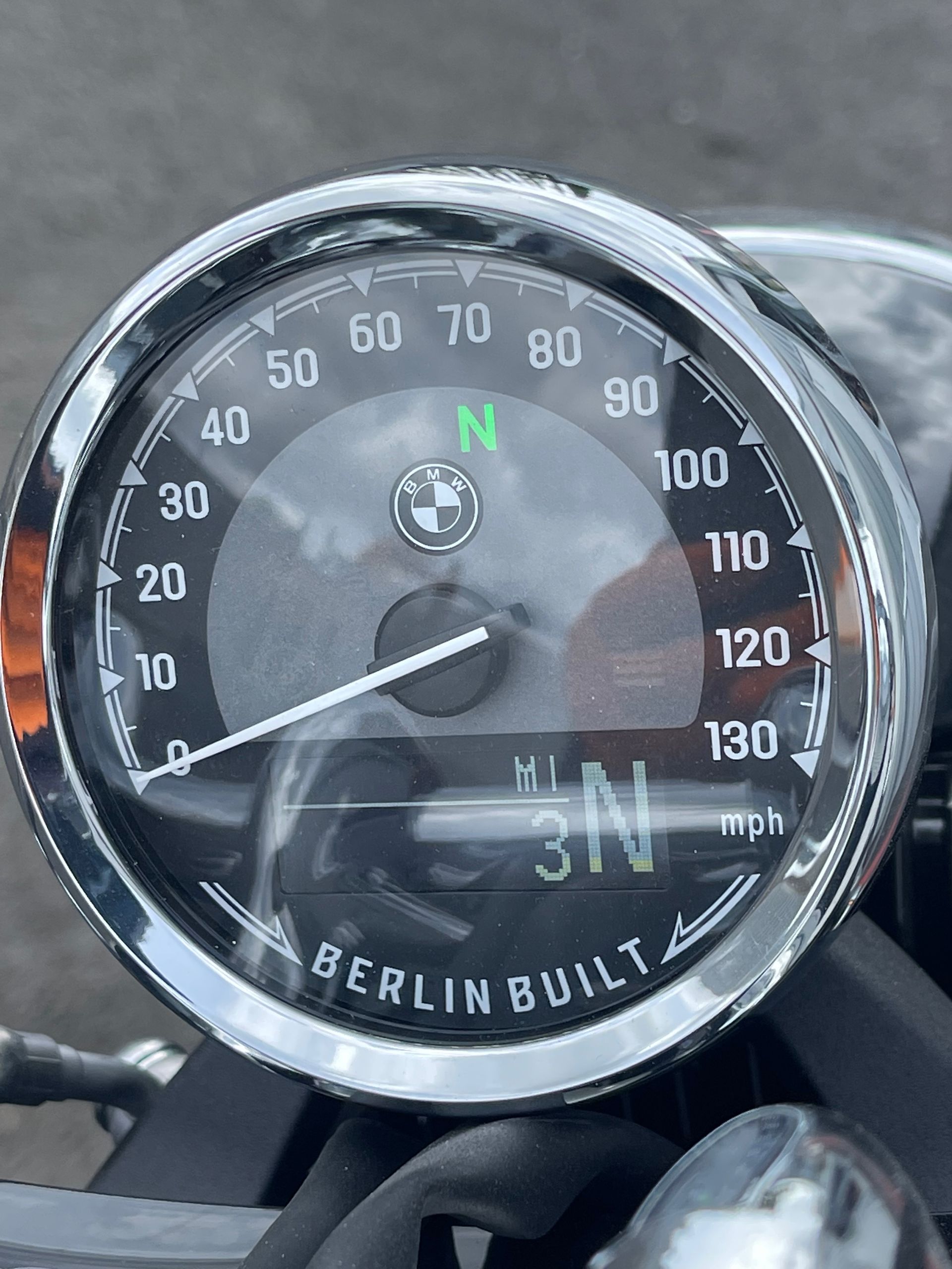 A close up of a speedometer on a berlin built motorcycle