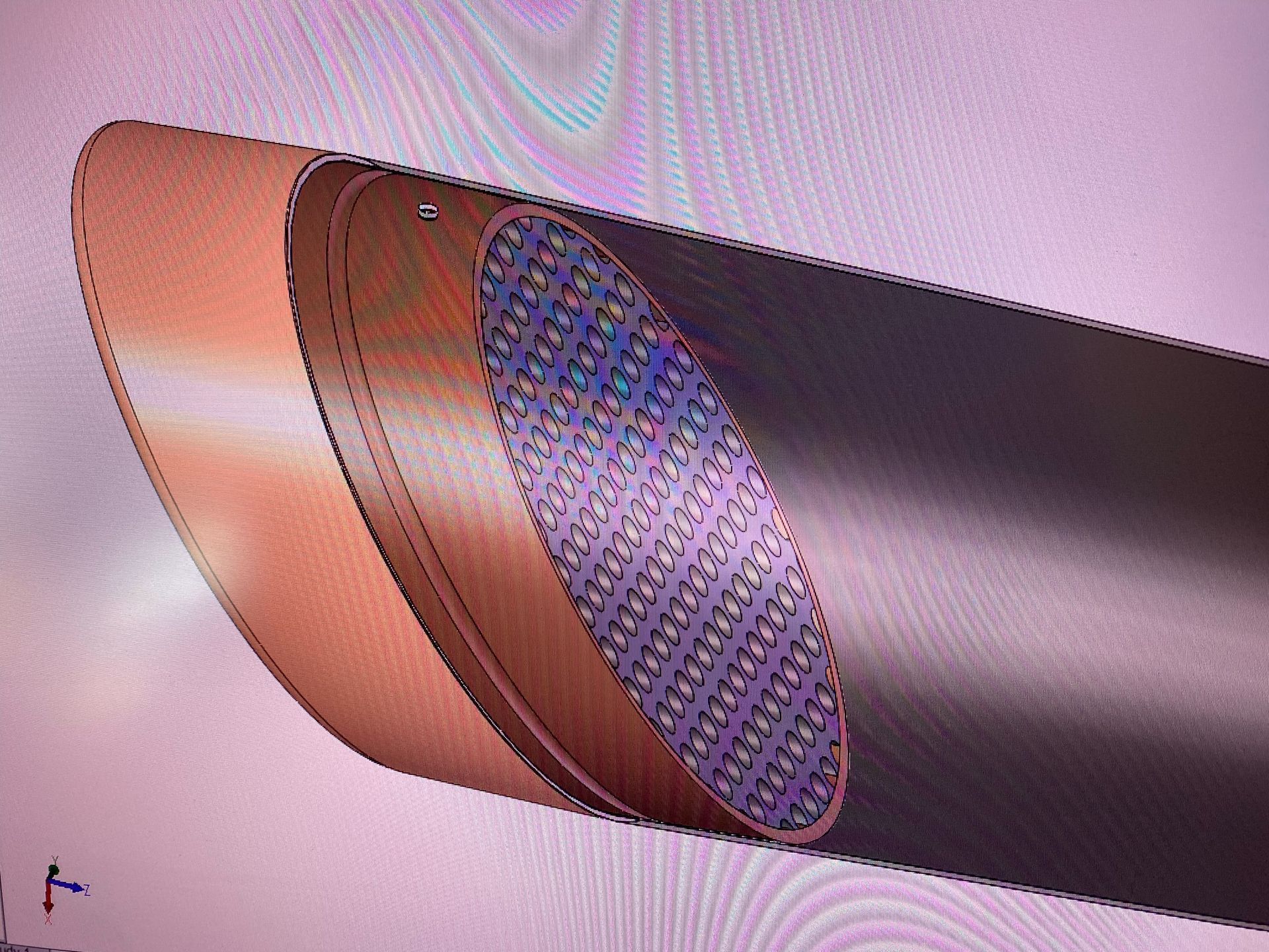 A computer screen shows a drawing of a pipe