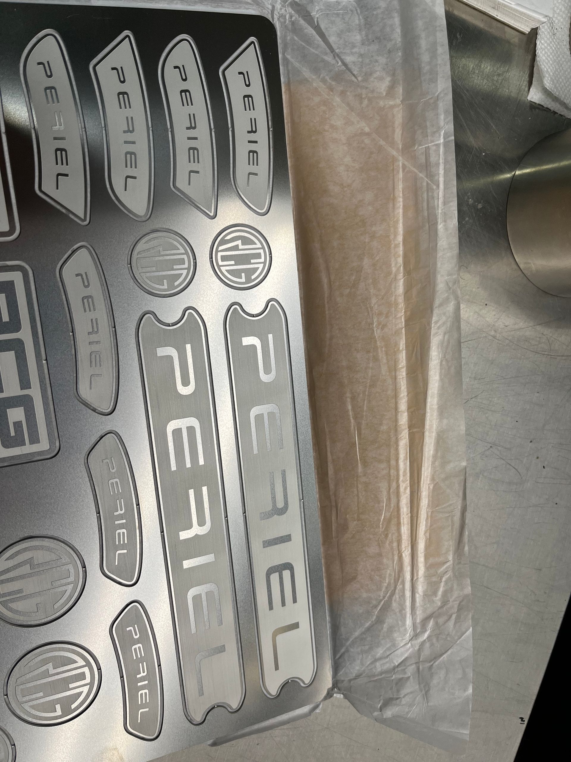 A piece of metal with the word rebel on it