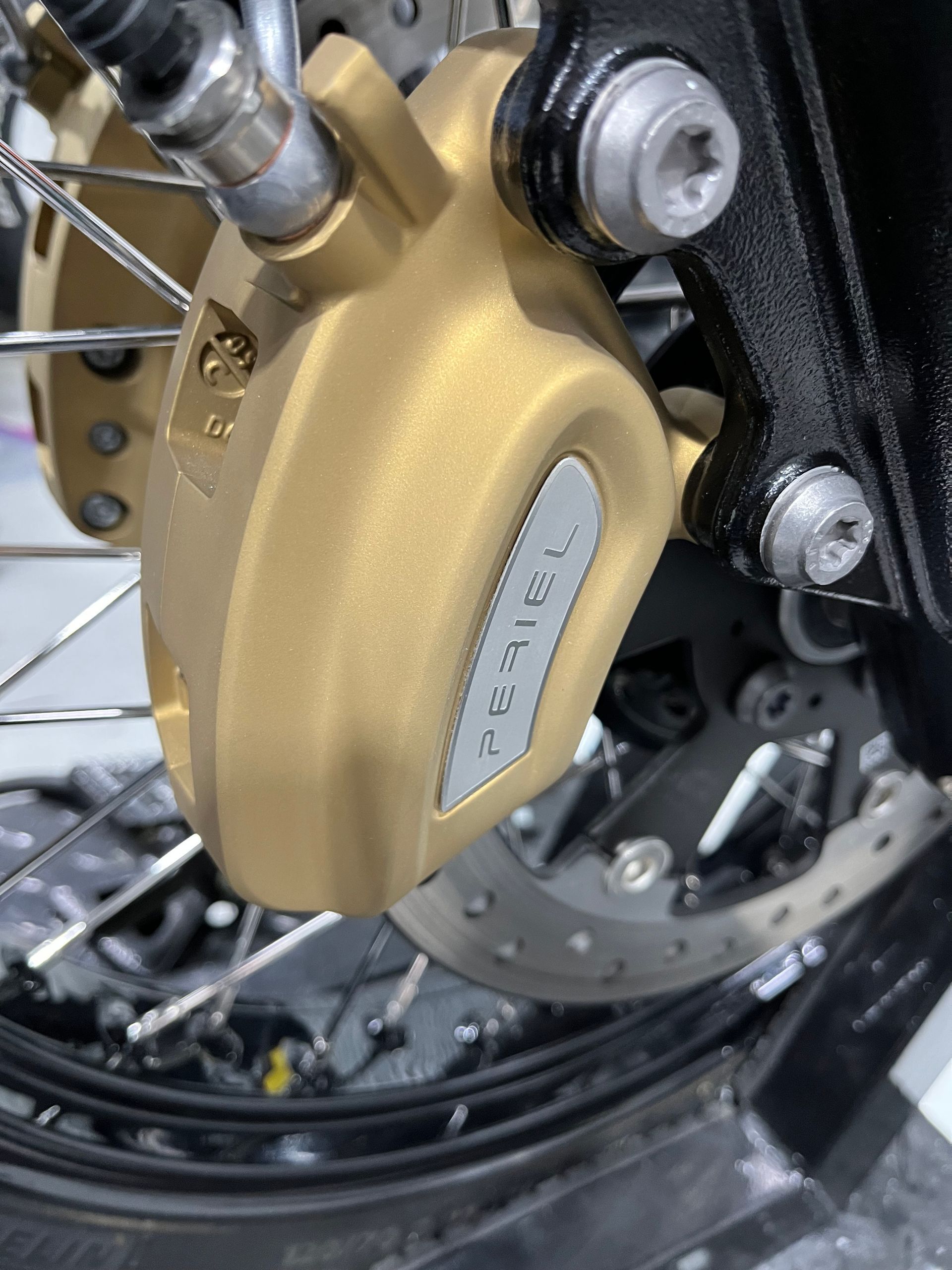 A close up of a brake caliper on a motorcycle