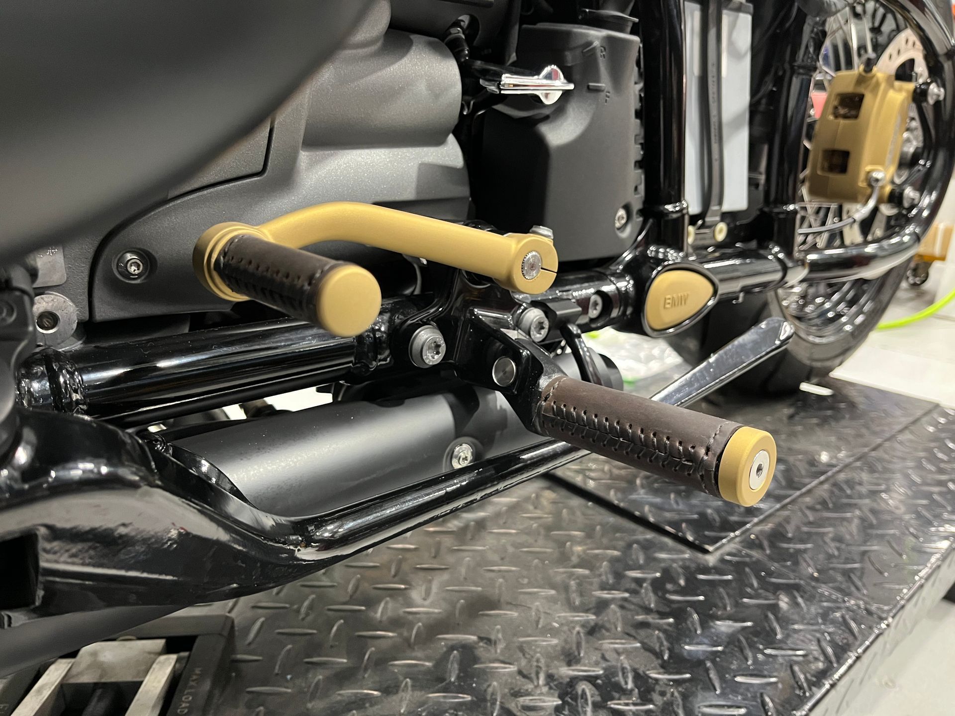 A motorcycle is sitting on top of a metal platform.