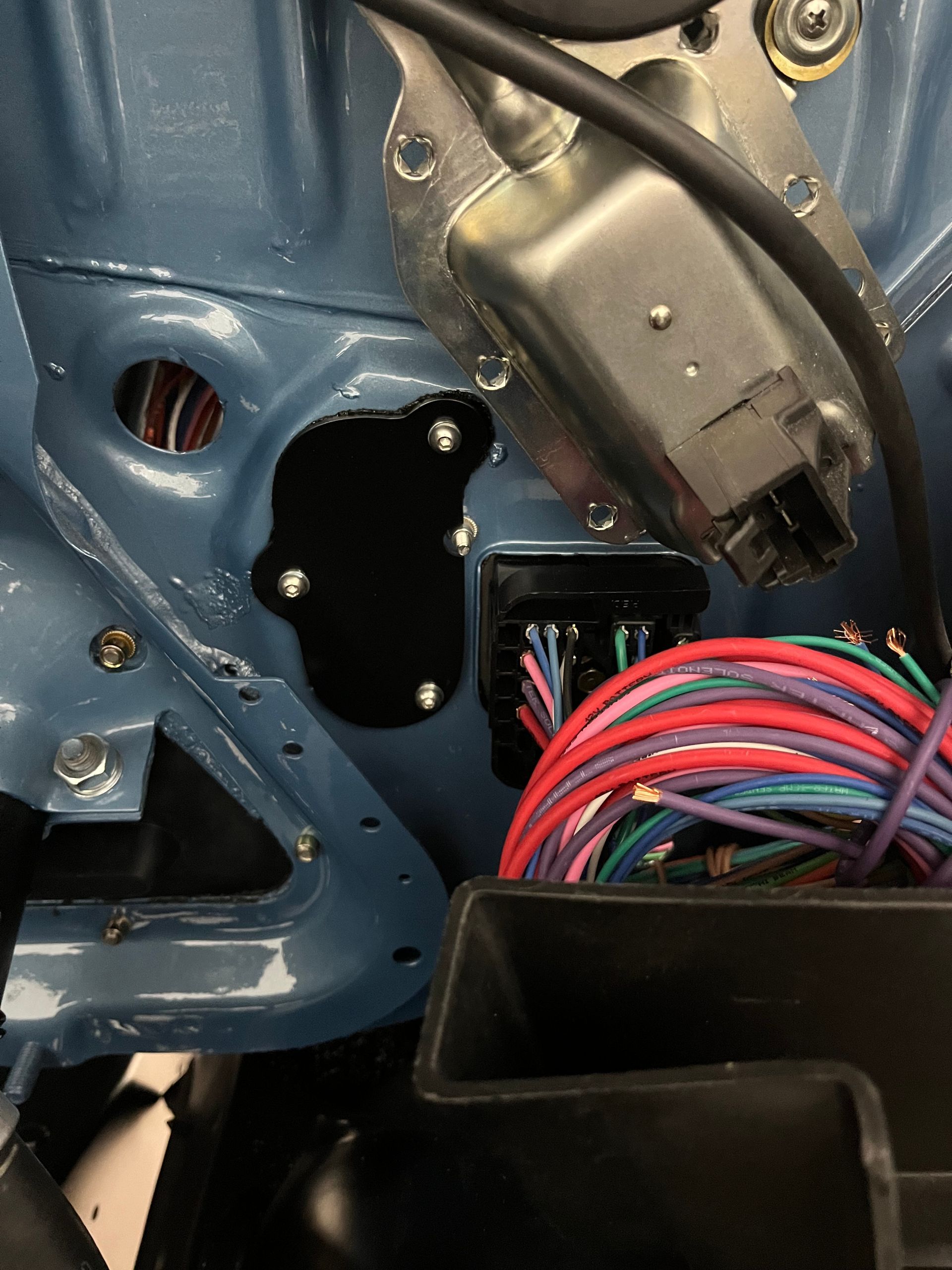 A car with a bunch of wires coming out of it