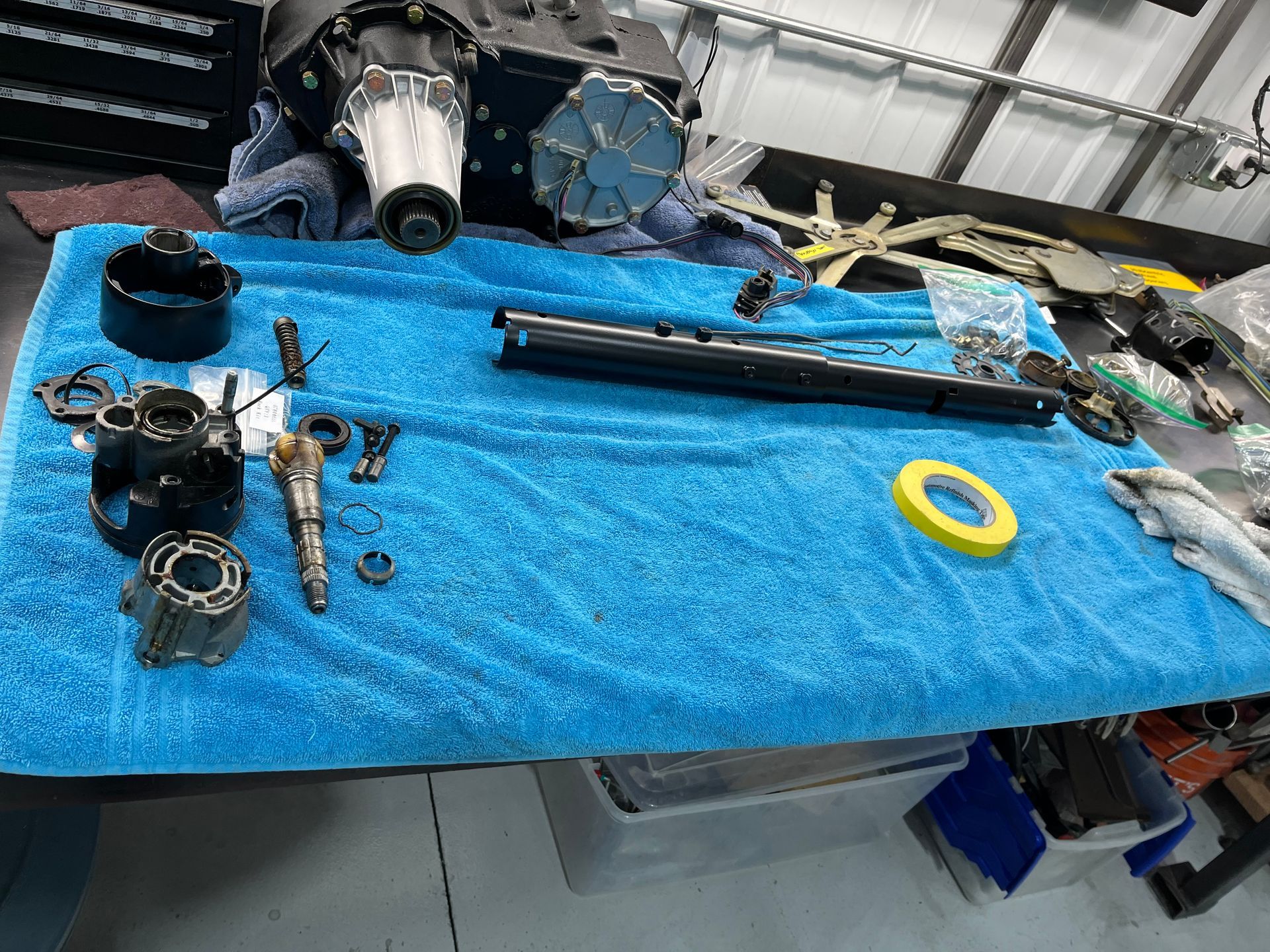 A blue towel with a bunch of parts on it